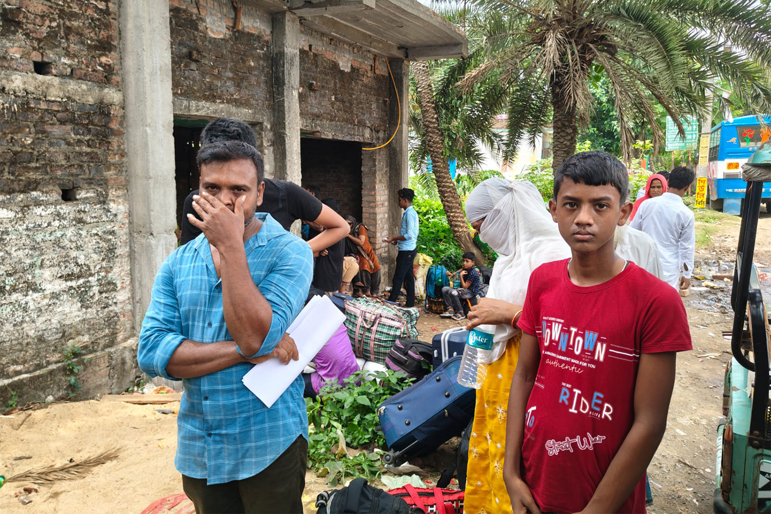 Raisul Islam, left, stands with his family at Hakimpur, West Bengal, India