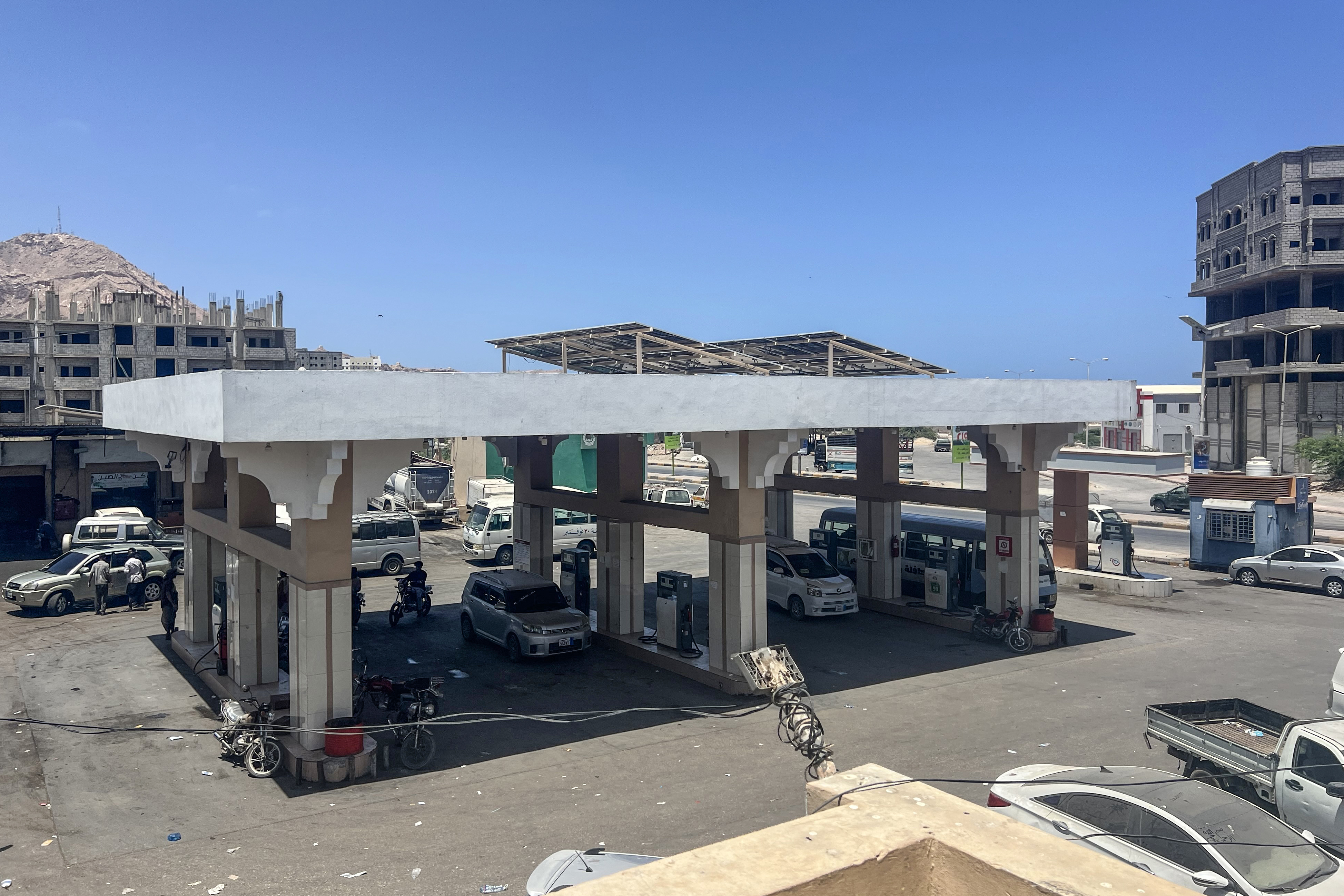 Solar panels cover the roof of a fuel station in Yemen’s city of Mukalla, where businesses, like many households, have turned to renewable energy to cope with prolonged power cuts and keep operations running.