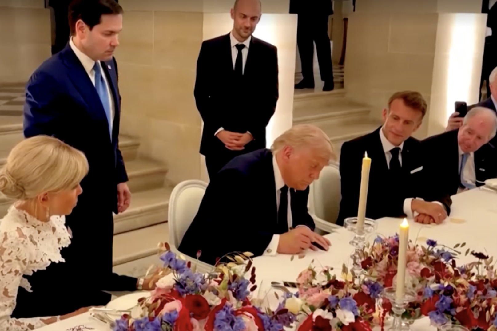 US President Donald Trump at a signing ceremony in the palace at Versailles, near Paris