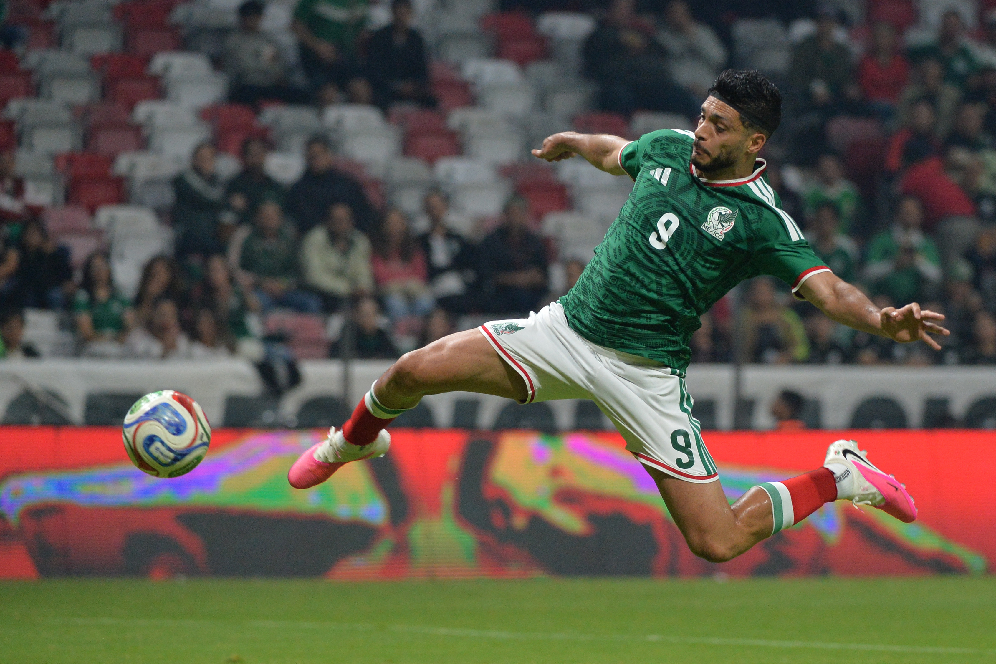 Mexico's forward #09 Raul Jimenez jumps for the ball.