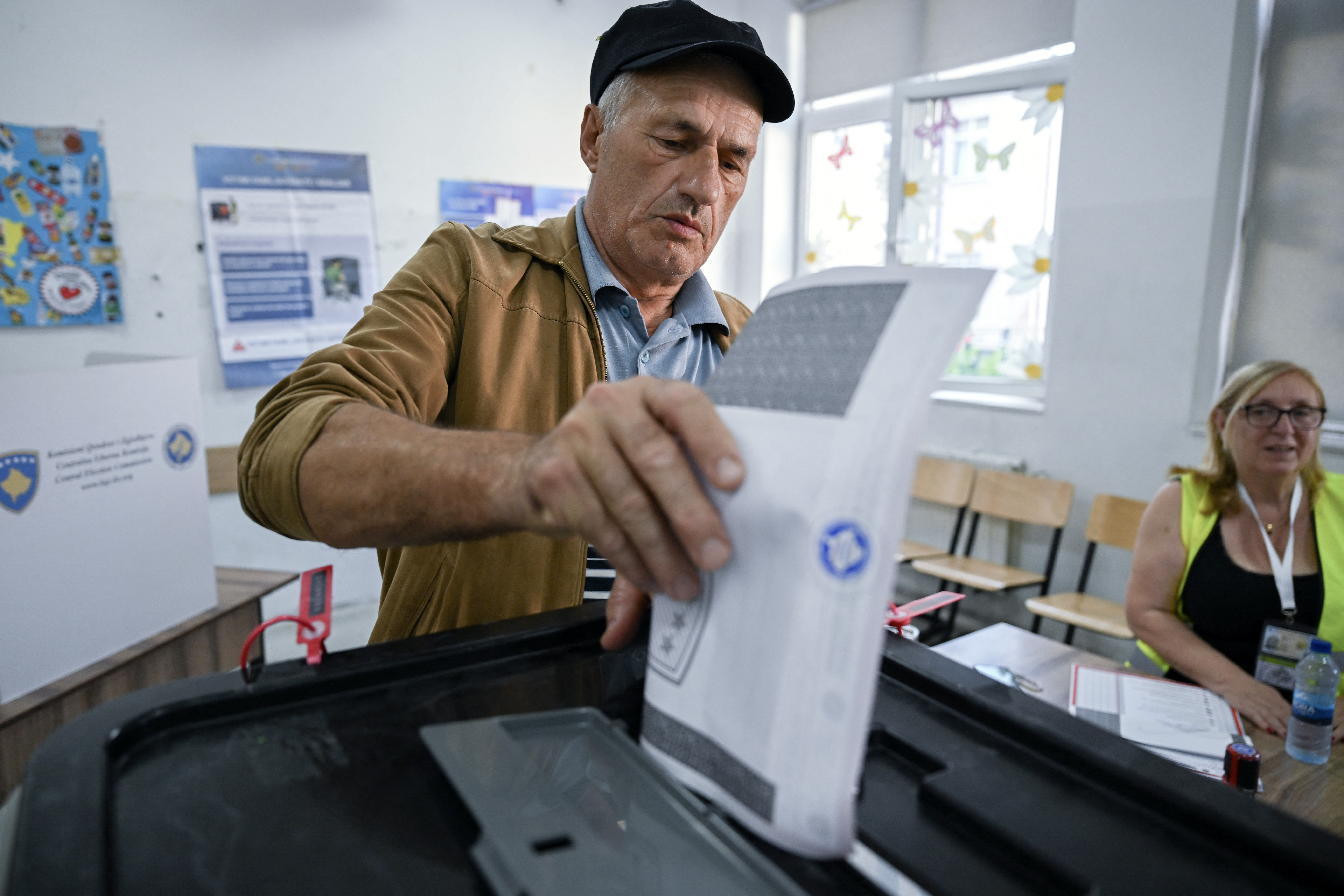 A man casts his ballot at a polling station.