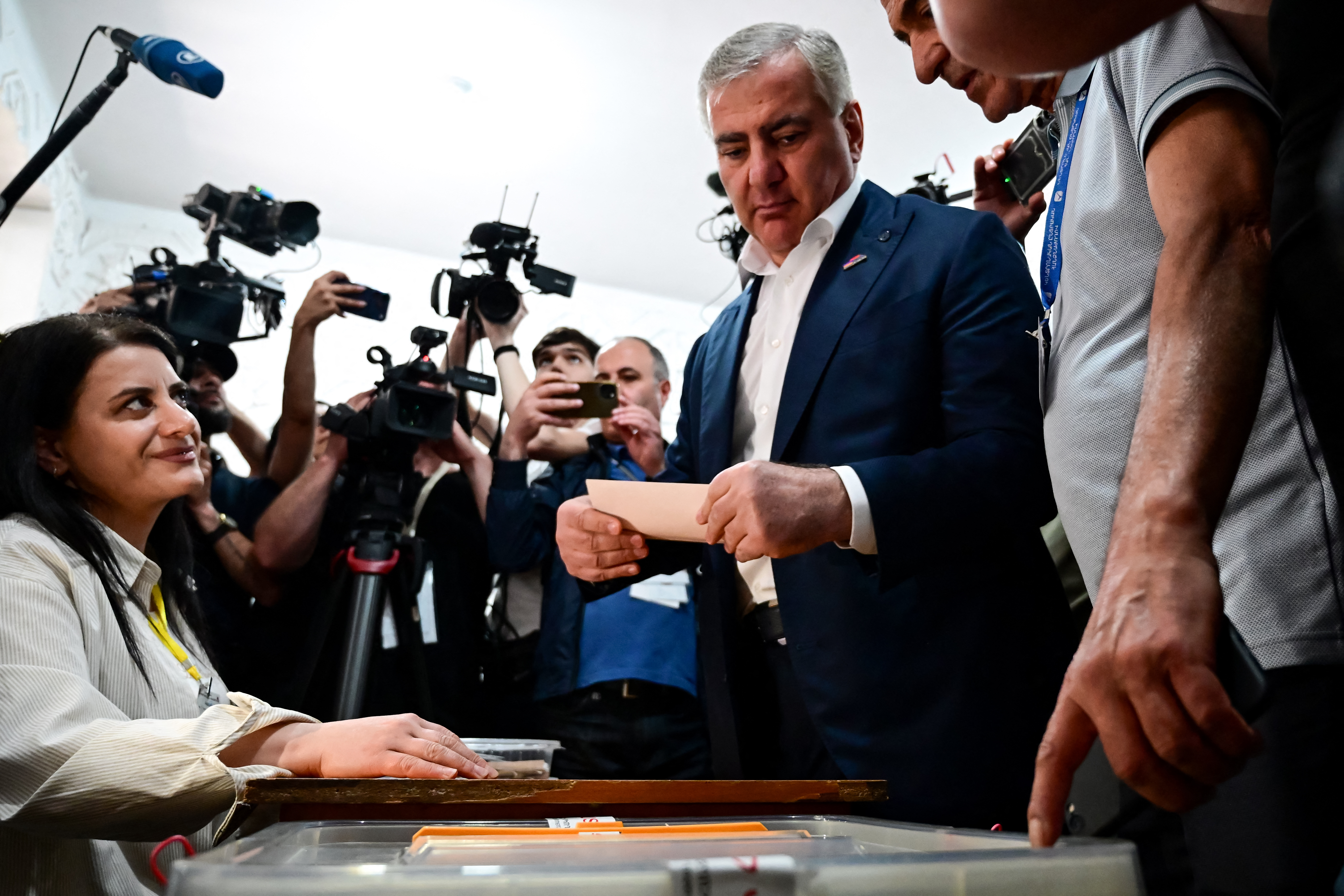 Billionaire Russian-Armenian businessman Samvel Karapetyan, the leader of Strong Armenia party who is under house arrest on charges of plotting a coup, casts his ballot in Armenia's parliamentary election at a polling station in Yerevan on June 7, 2026. (Photo by Karen MINASYAN / AFP)