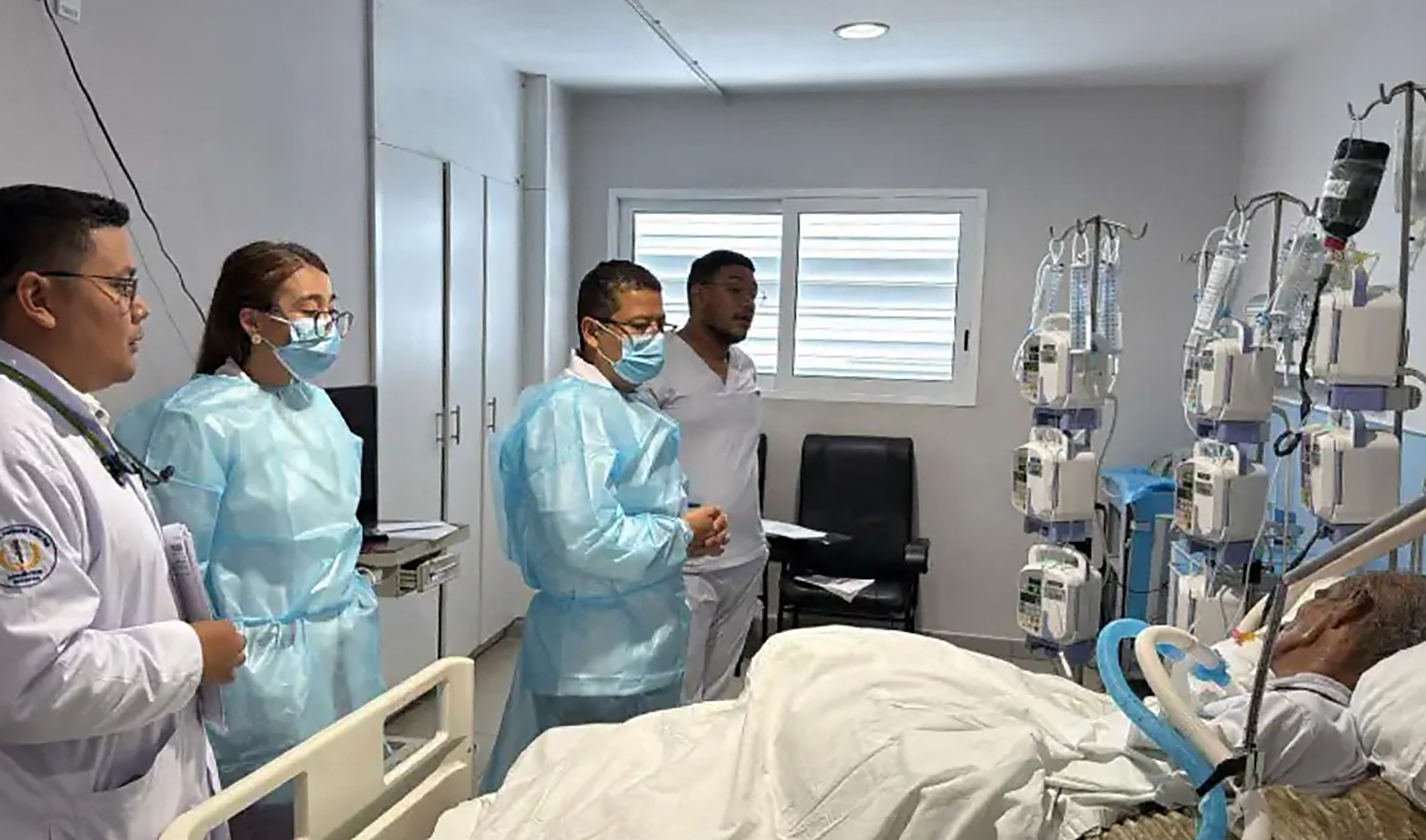 This handout courtesy picture released on May 29, 2026, by the Nicaragua's Health Ministry via the official El 19 Digital news outlet shows medical staffers surrounding political indigenous prisoner Brooklyn Rivera -lying down on a bed- at the Fernando Velez Paiz hospital in Managua.