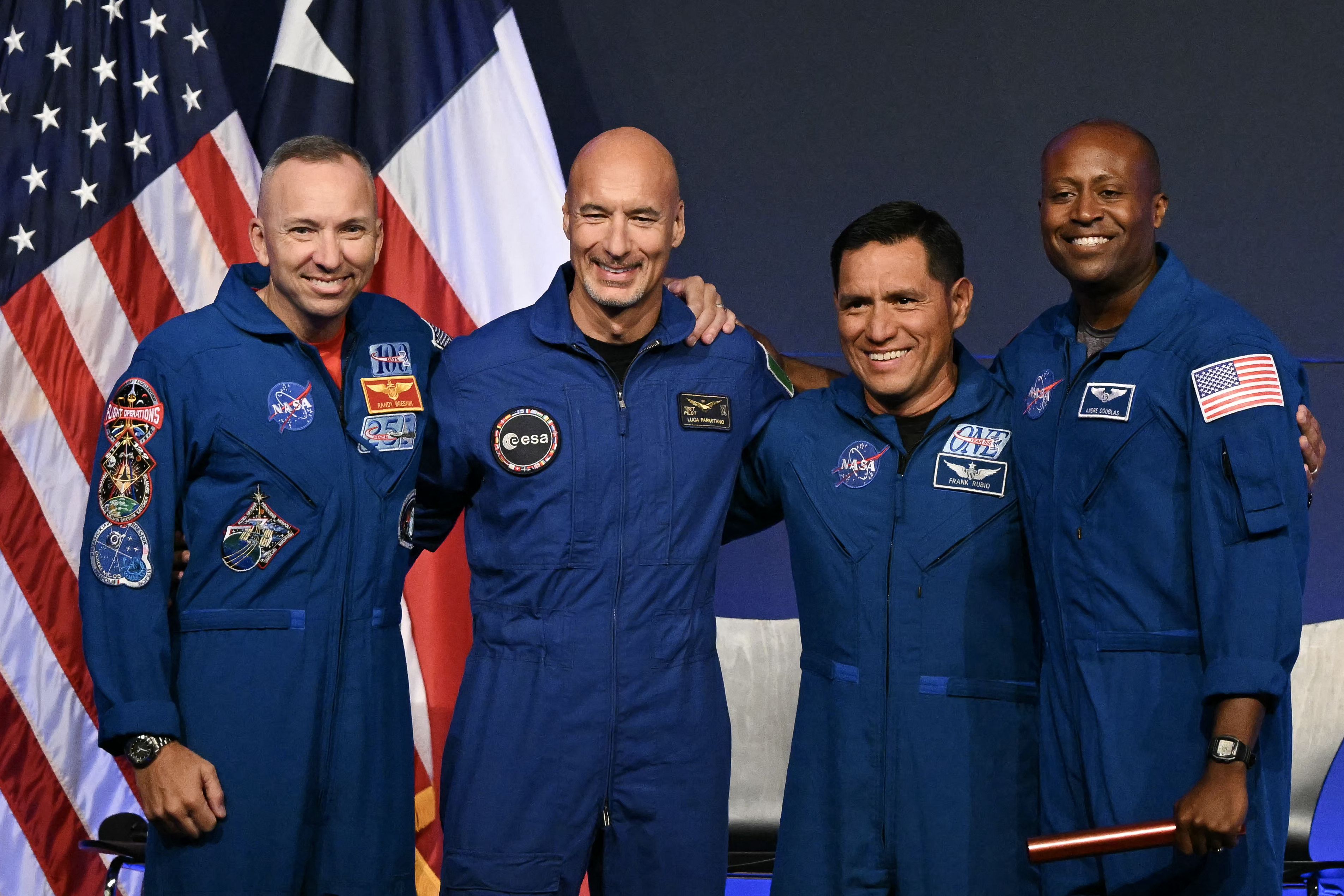 (L/R) NASA astronaut commander Randy Bresnik, ESA (European Space Agency) astronaut pilot Luca Parmitano, NASA astronaut mission specialist Frank Rubio, and NASA astronaut mission specialist Andre Douglas speak during a press conference announcing the crew for the Artemis III mission at NASA's Johnson Space Center in Houston, Texas, on June 9, 2026.