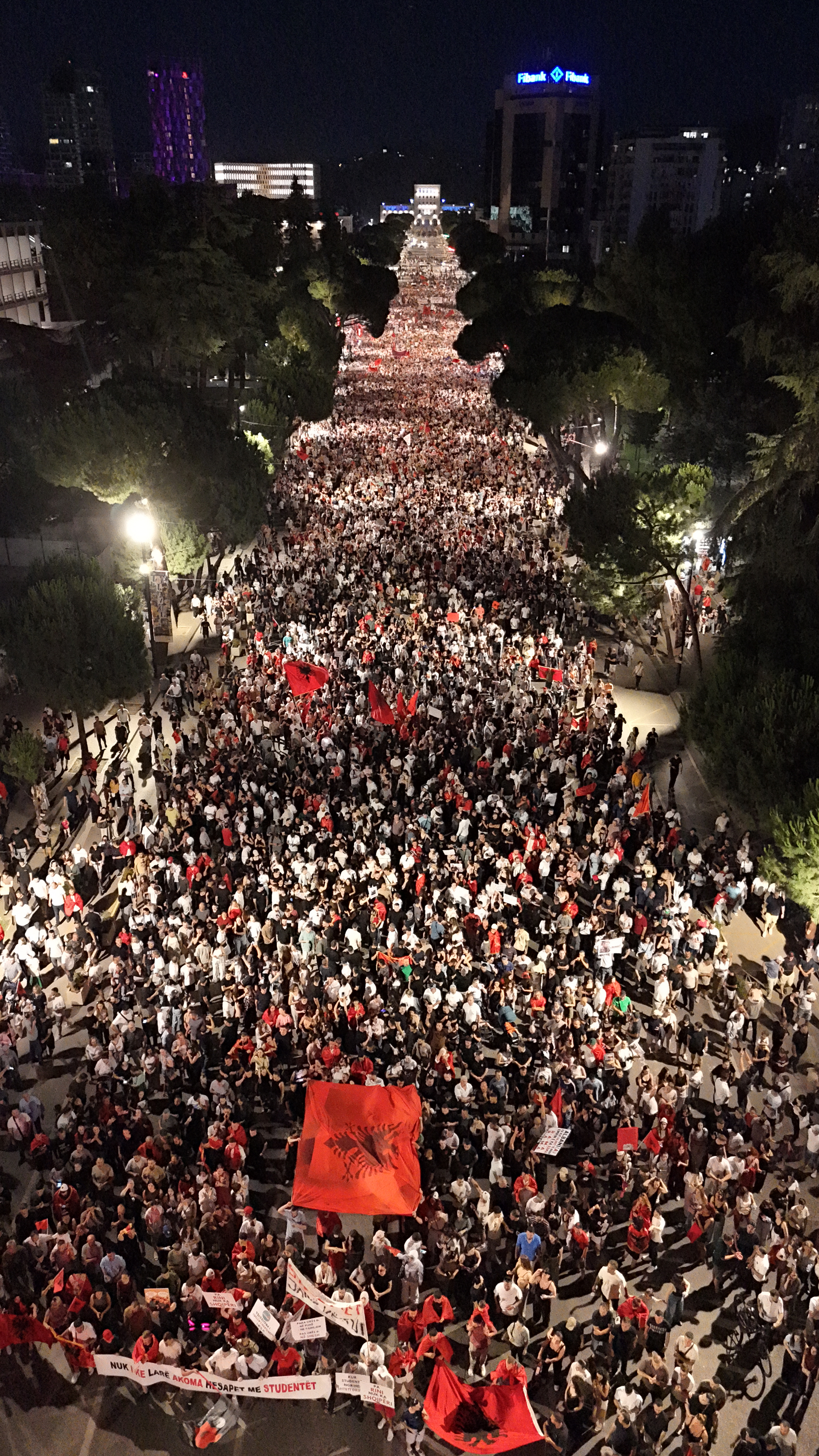 This drone photograph shows protesters in front of the Albanian Prime Minister's Office to demonstrate against the construction of a luxury resort near a protected natural area