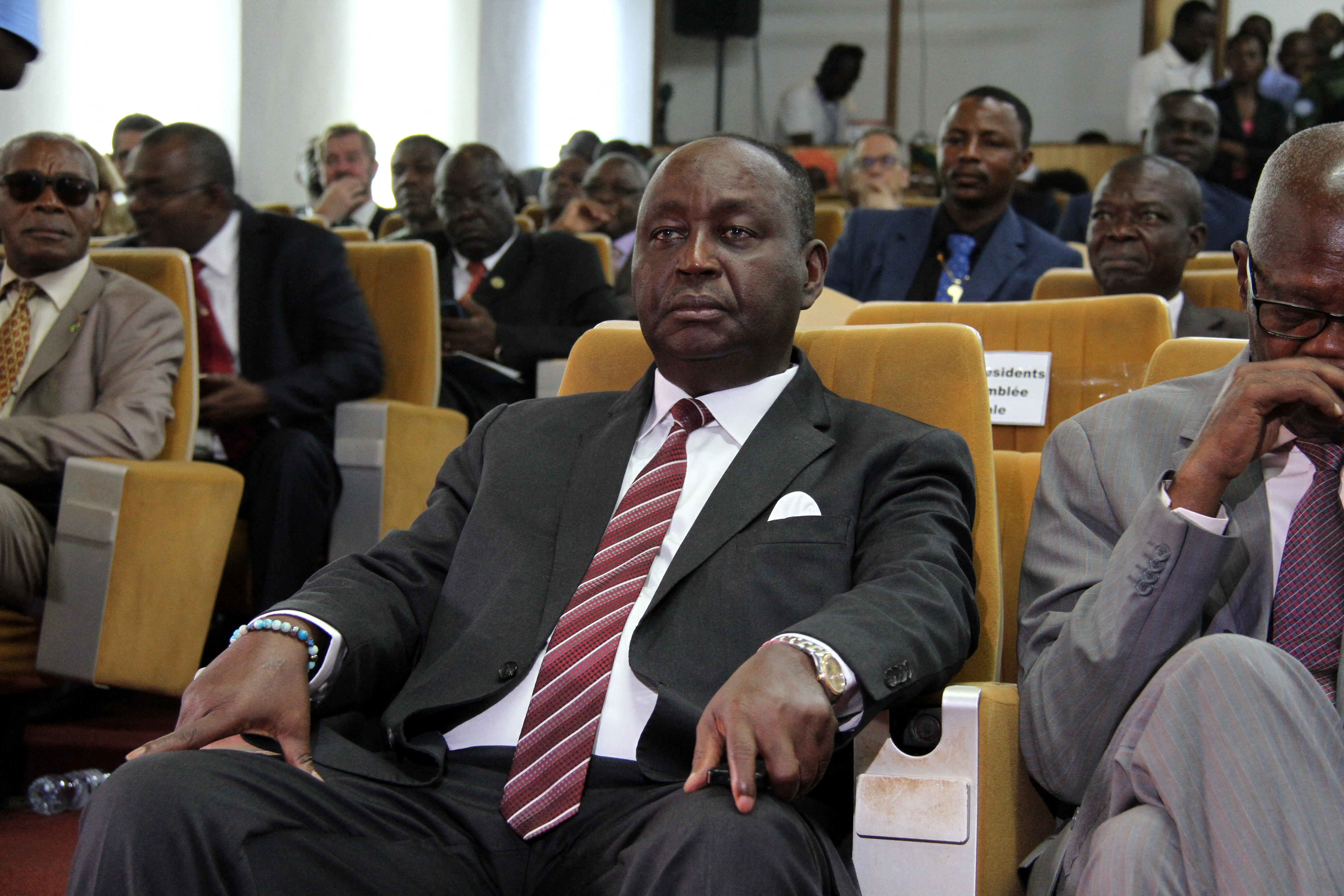 Francois Bozize, former president of the Central African Republic, sits with other members in an audience.