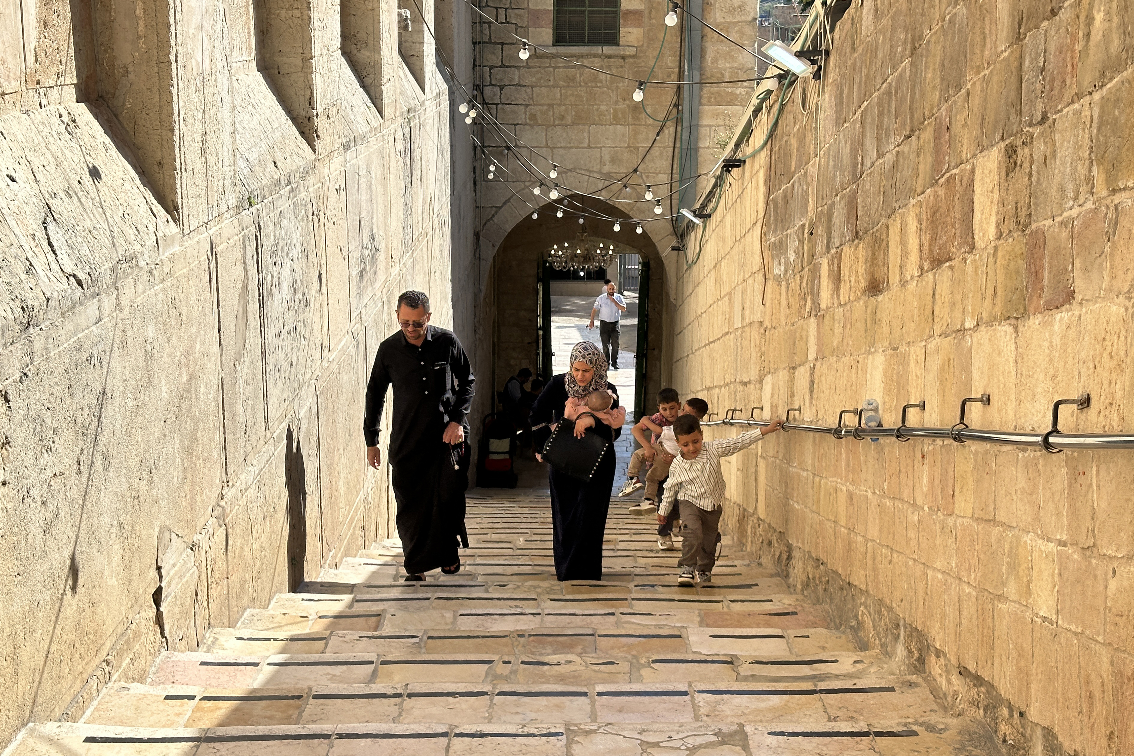 Palestinians arrive to celebrate the Islamic Hijri New Year at the Ibrahimi Mosque, known to Jews as the Cave of the Patriarchs, located inside the Israeli-controlled H2 sector of the occupied West Bank city of Hebron, on June 16, 2026.