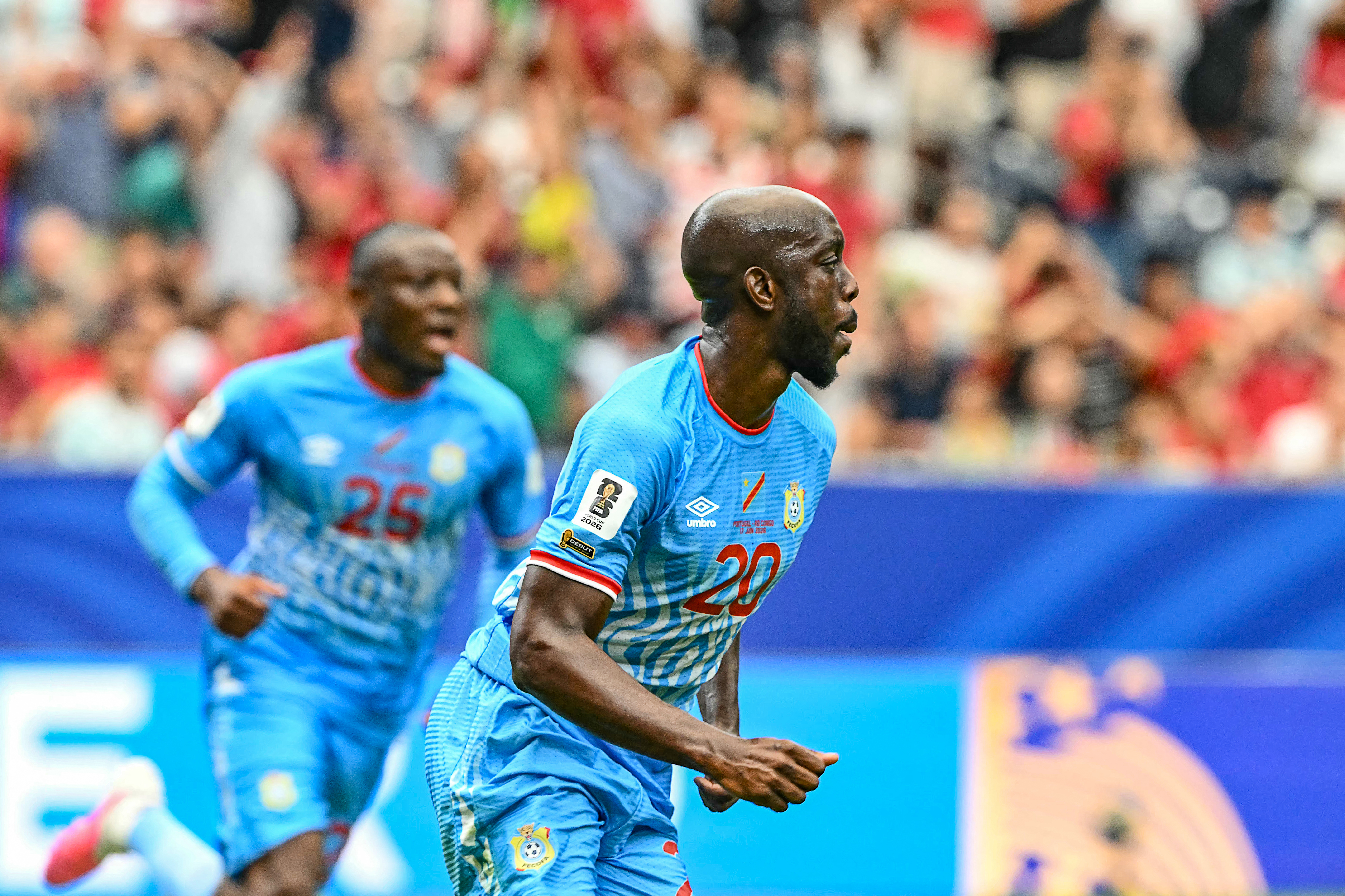 Congo DR's forward #20 Yoane Wissa (L) celebrates after scoring his team's first goal during the 2026 World Cup Group K football match between Portugal and the Democratic Republic of Congo at the Houston Stadium in Houston on June 17, 2026.