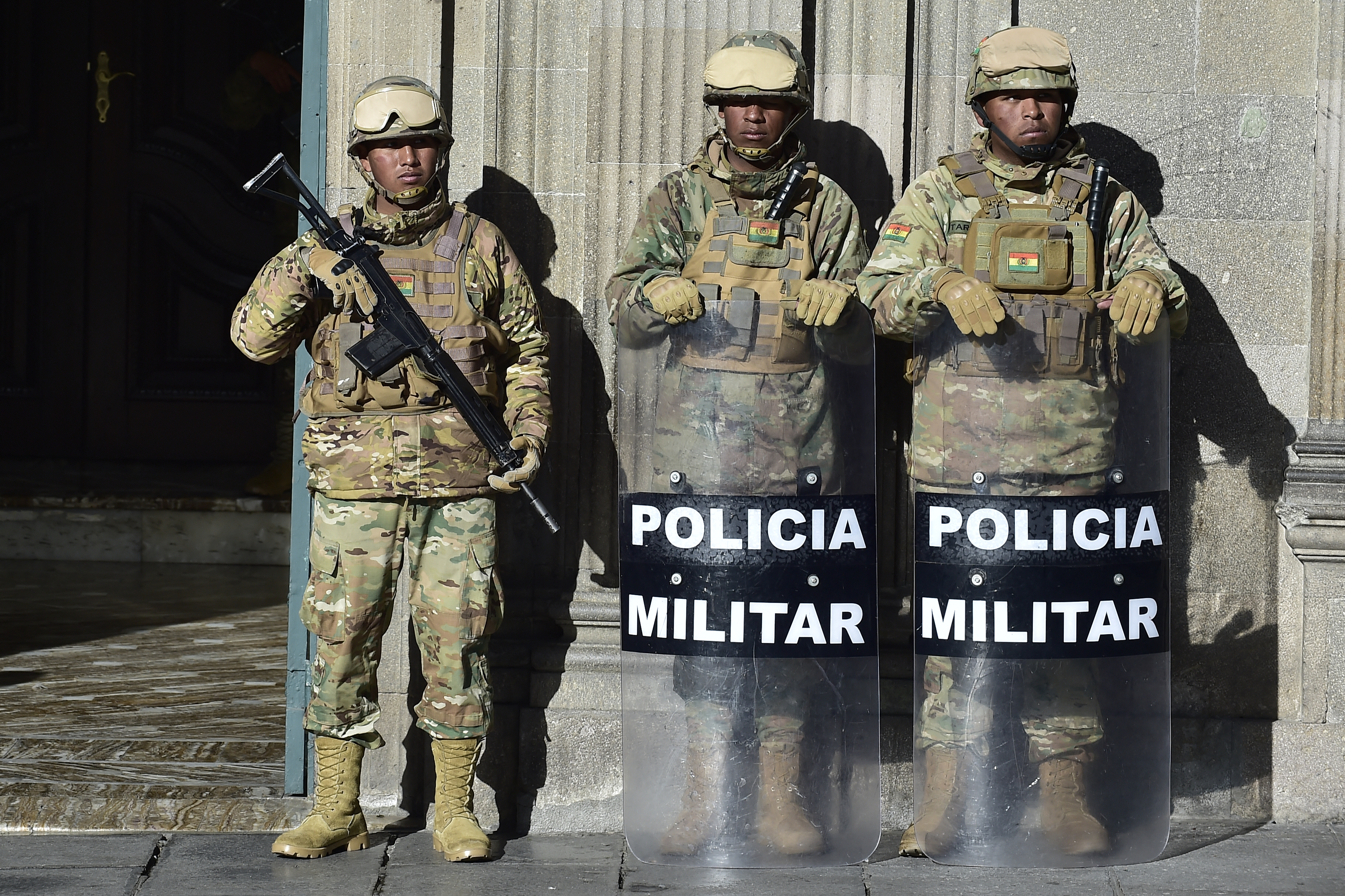Military Police stand guard outside the Quemado presidential palace in La Paz on June 20, 2026, after Bolivian president Rodrigo Paz declared state of emergency.