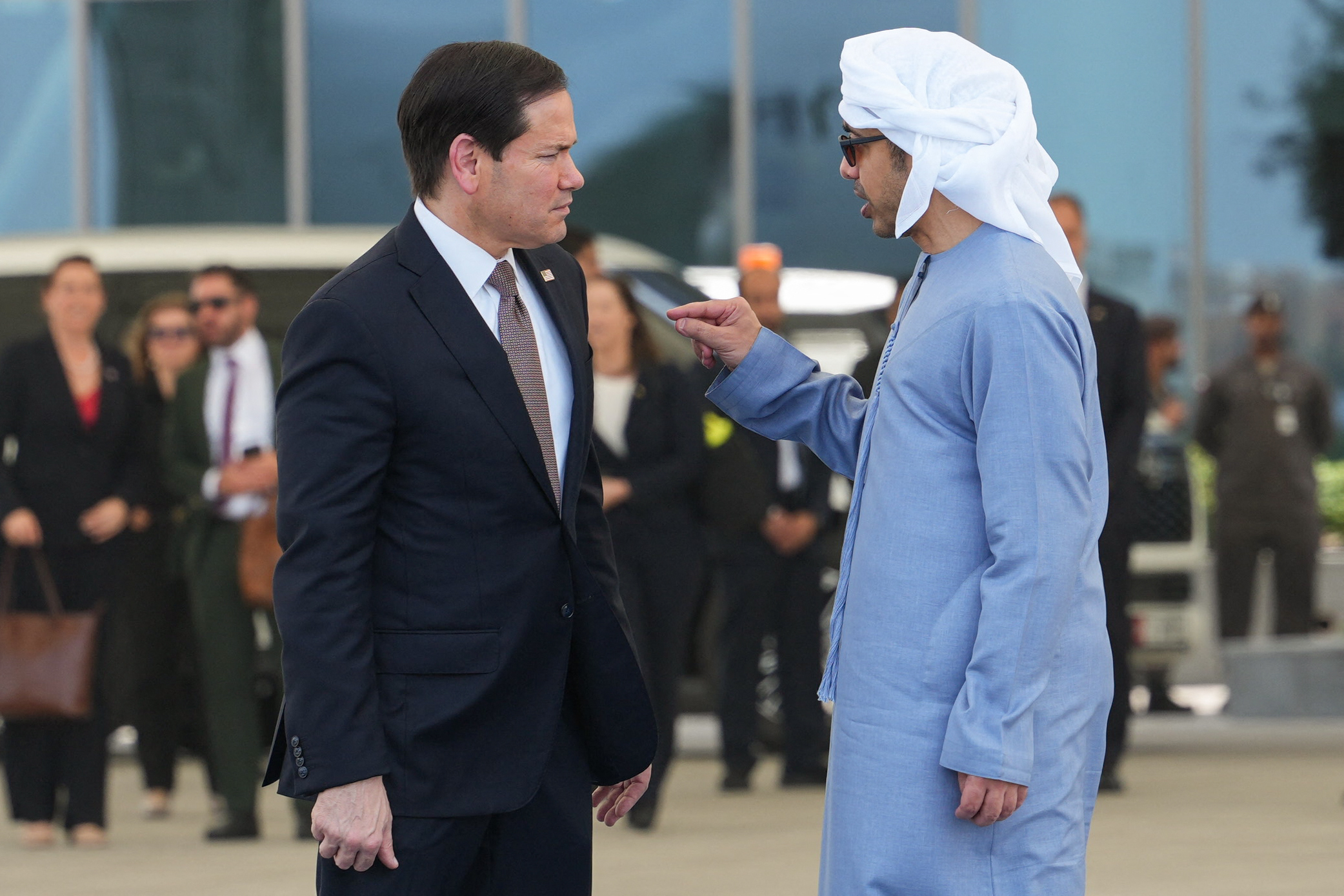 US Secretary of State Marco Rubio (L) talks to UAE Foreign Minister Sheikh Abdullah bin Zayed Al-Nahyan before boarding a US Air Force aircraft at Al-Bateen Executive Airport, en route to Kuwait, in Abu Dhabi on June 24, 2026.