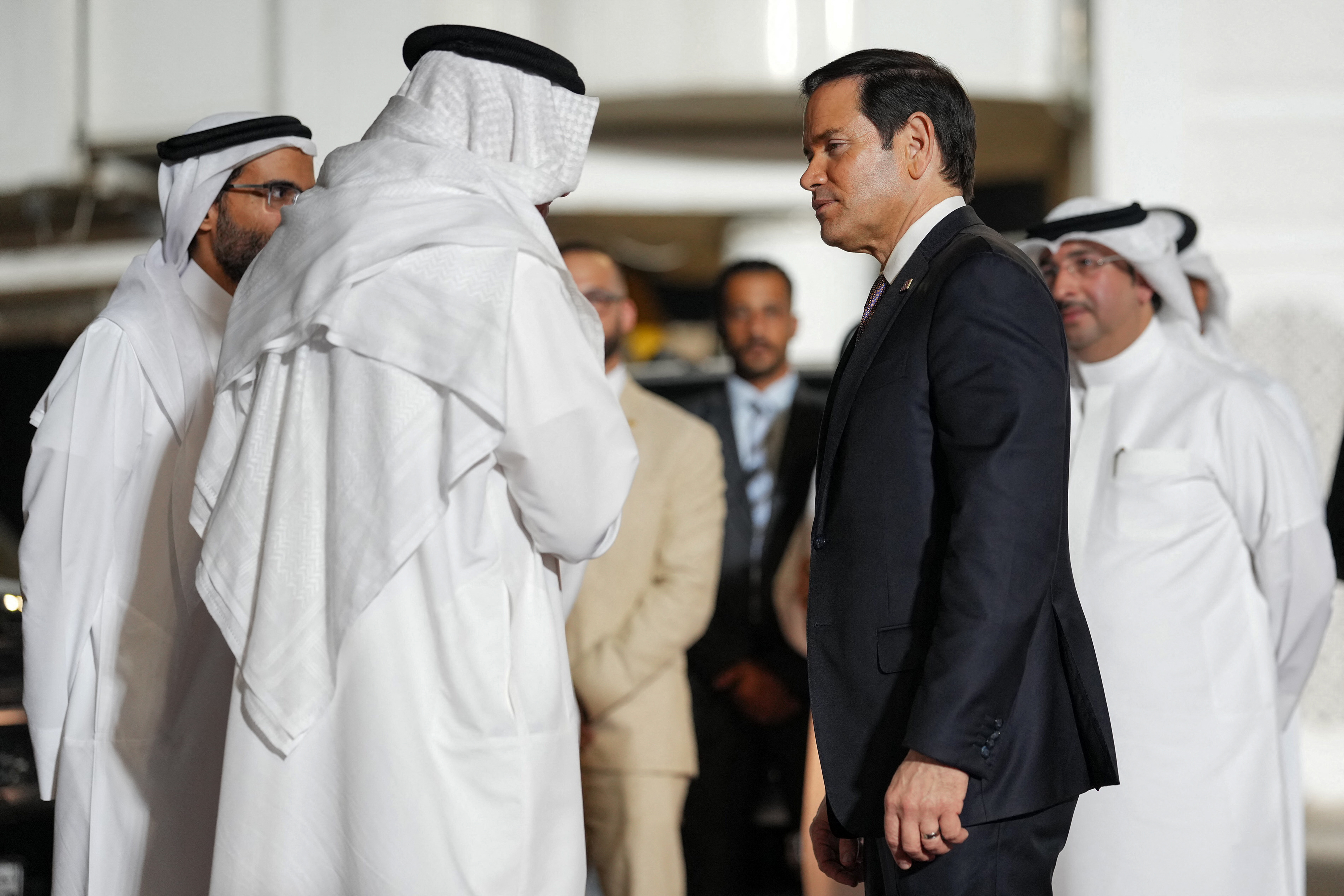 Bahrain's Foreign Minister Abdullatif bin Rashid al-Zayani receives US Secretary of State Marco Rubio upon arrival at Bahrain International Airport near Manama on June 24, 2026, during Rubio's visit to the Middle East to discuss the interim deal between the US and Iran with Arab Gulf allies.