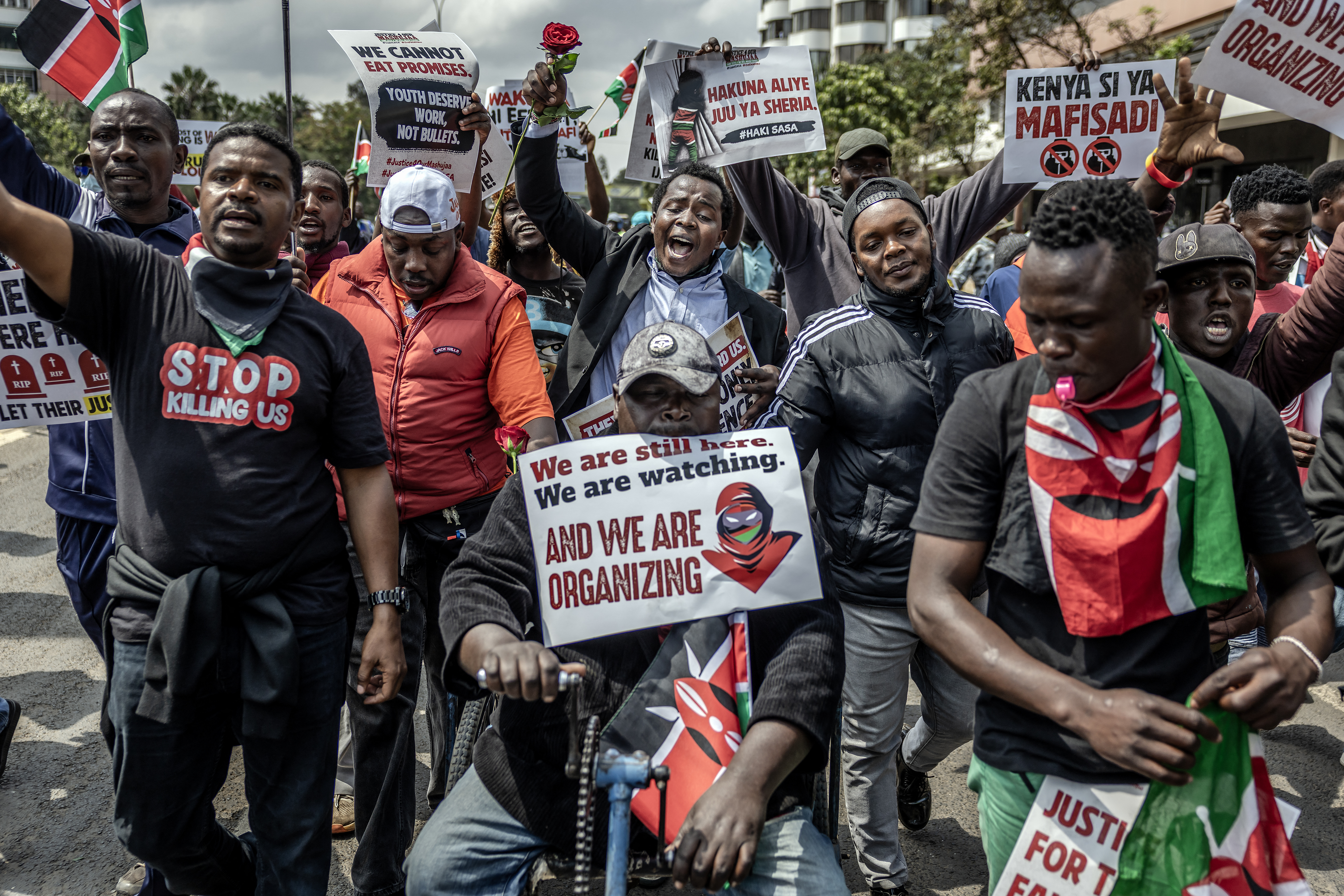 Protesters hold placards and chant anti-government slogans as they march during demonstrations marking the second anniversary of the deadly June 2024 youth-led anti-Finance Bill protests, which saw demonstrators storm Parliament, in Nairobi on June 25, 2026.