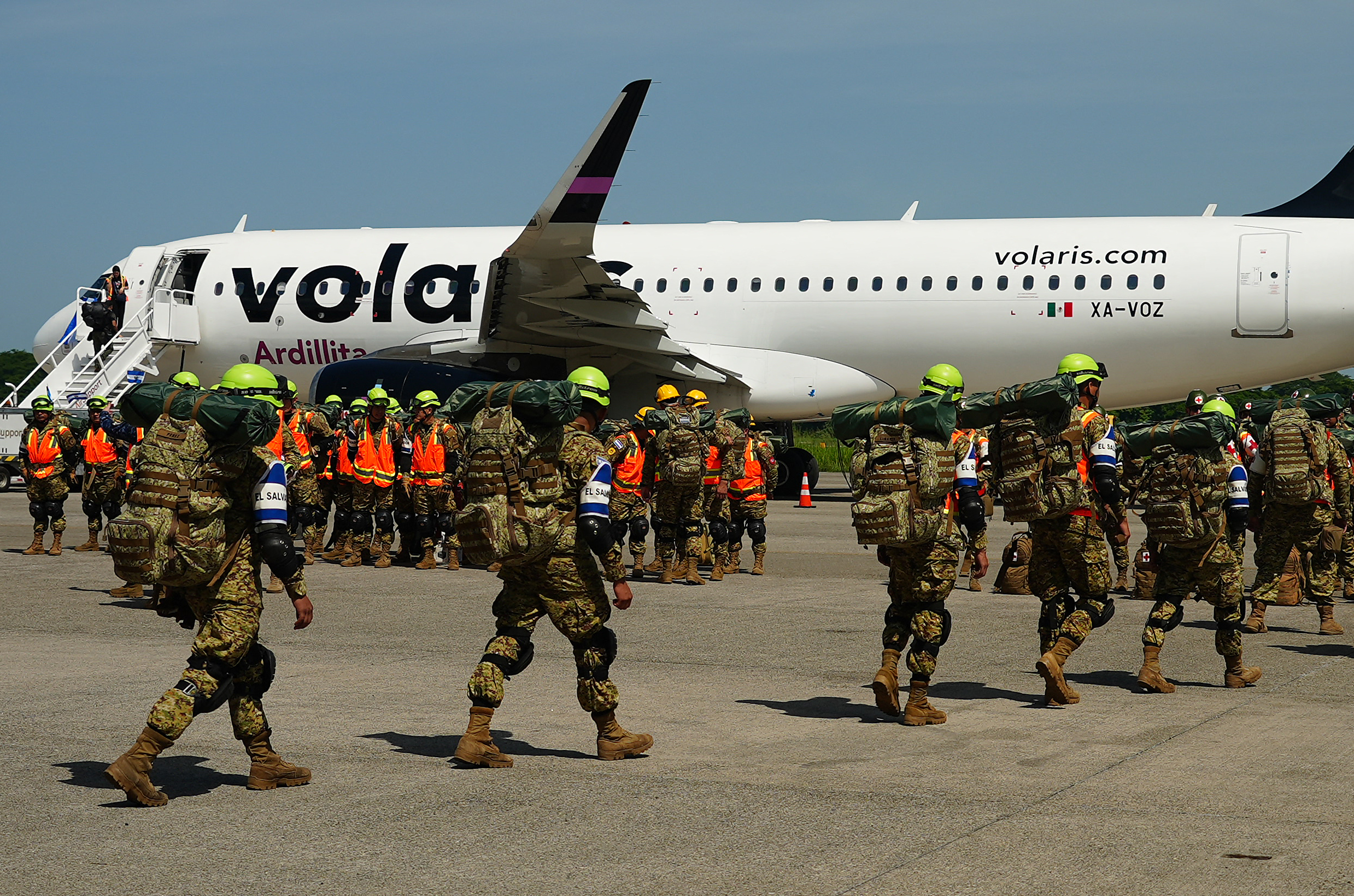 Salvadorean soldiers prepare to board a plane heading to Venezuela, at Comalapa Air Base in San Luis Talpa, on June 25, 2026.