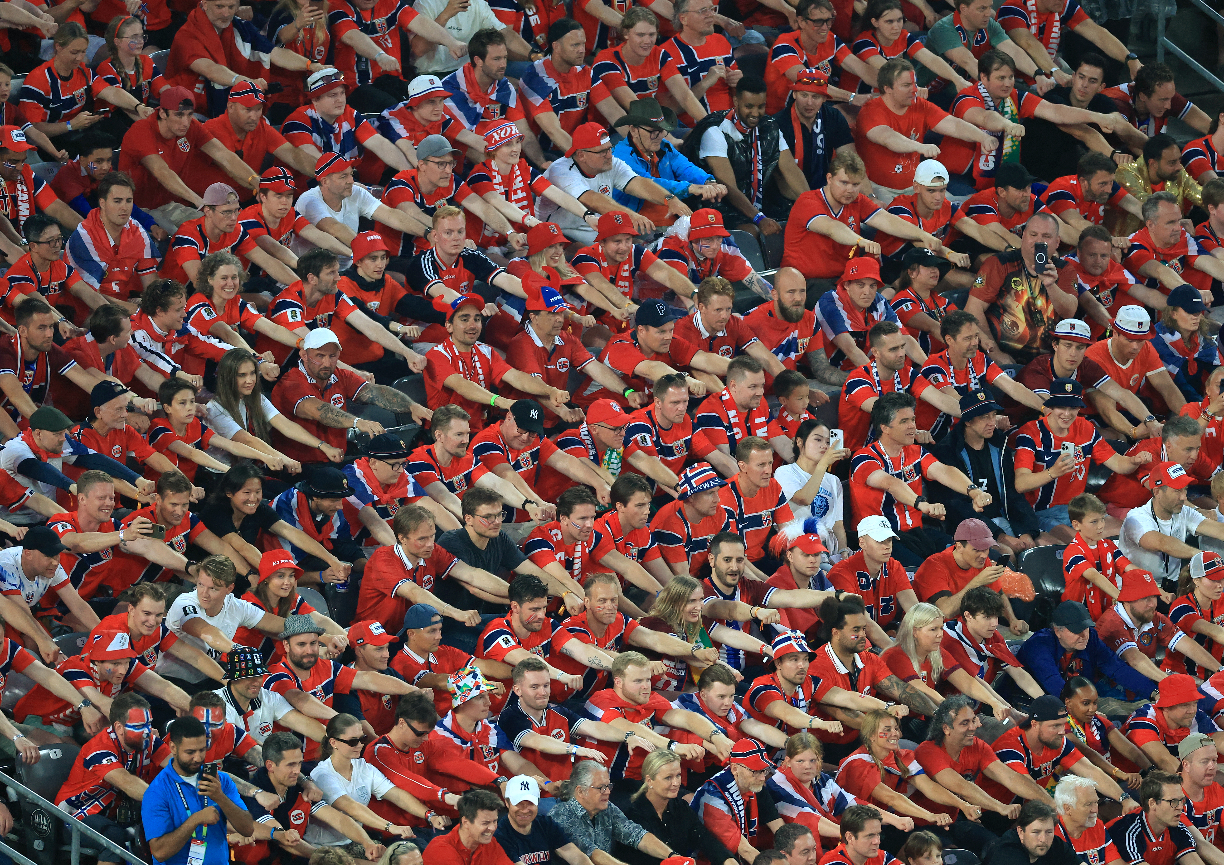 Norway's fans cheer their team during a football match.