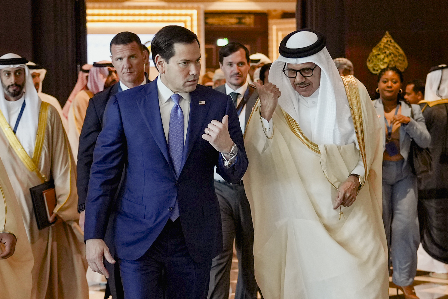 US Secretary of State Marco Rubio (L) walks along side Bahrain's Foreign Minister and Chairman of the GCC Ministerial Council session Abdullatif bin Rashid al-Zayani following a meeting with foreign ministers of the Gulf Cooperation Council Member States (GCC), in Manama on June 25, 2026.