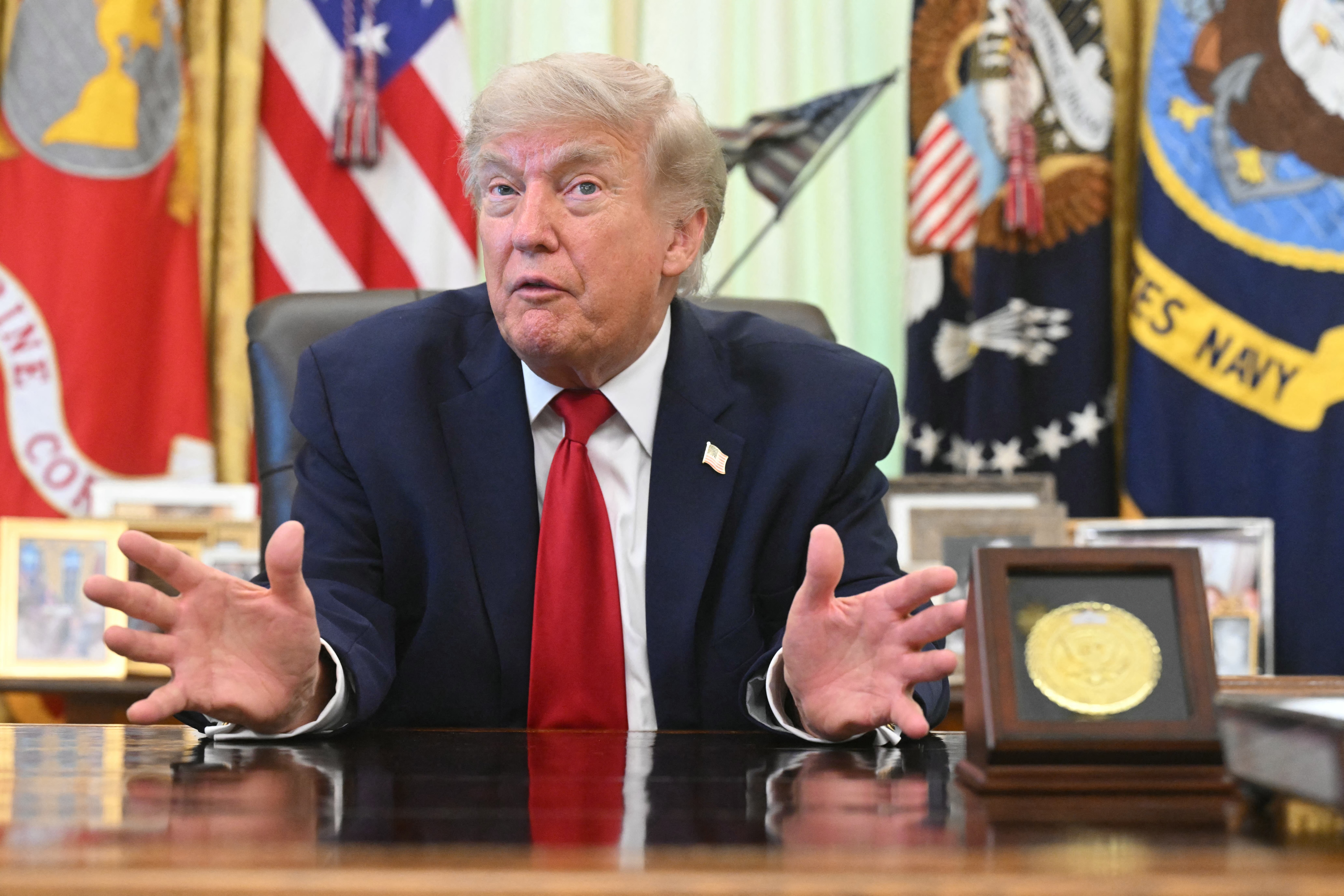US President Donald Trump speaks with reporters after signing a presidential memo on pollution control in vehicles at the Oval Office of the White House in Washington, DC, on June 29, 2026. (Photo by SAUL LOEB / AFP)
