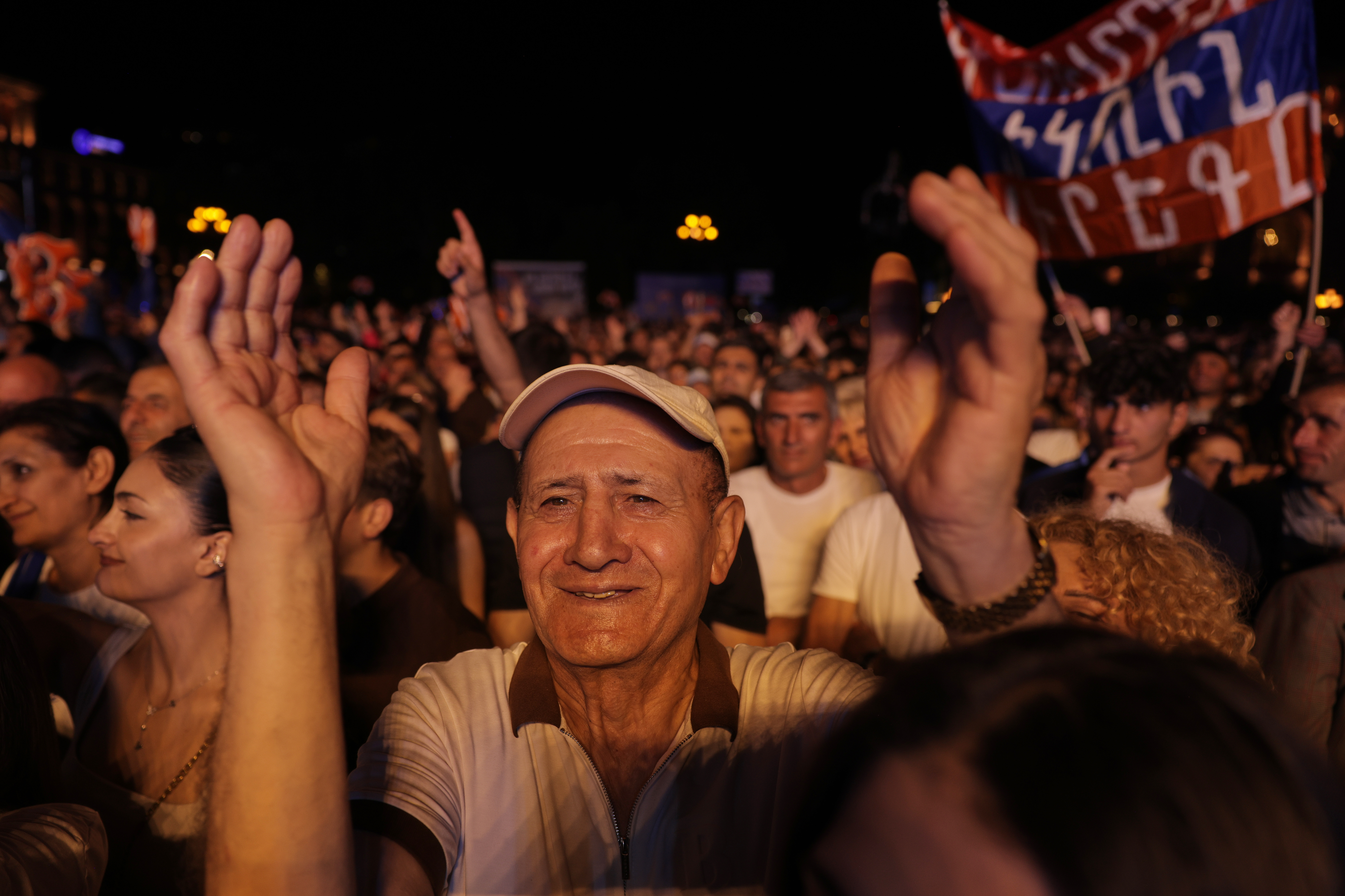 ON HOLD TO GO WITH ARMENIA ELECTION STORY Supporters of Armenia's ruling Civil Contract party leading by Prime Minister Nikol Pashinyan react as they gather in Republic Square in Yerevan, Armenia, Friday, June 5, 2026, for the party's final campaign rally ahead of the upcoming parliamentary elections. (AP Photo/Anthony Pizzoferrato)