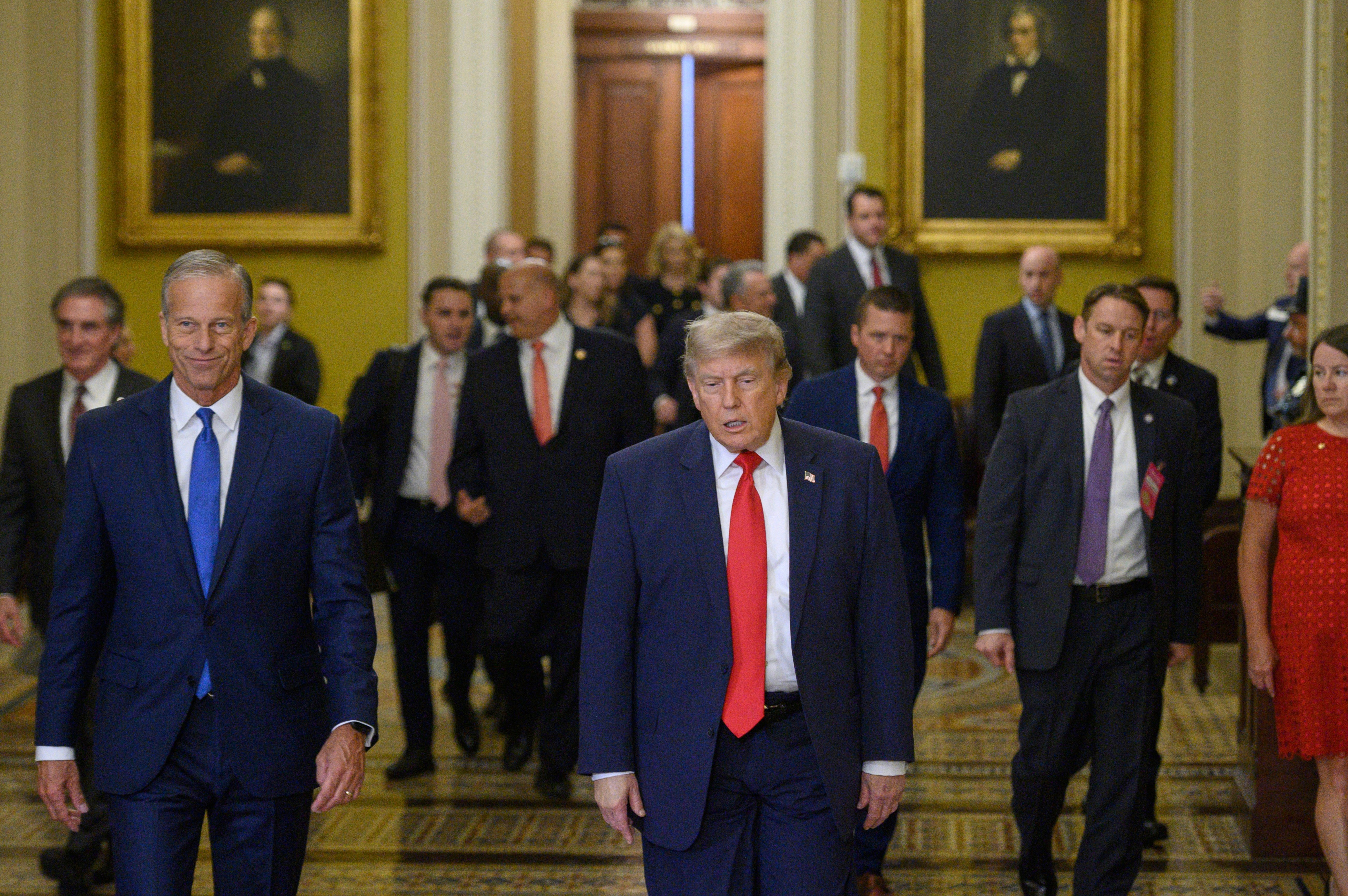 Senate Majority Leader John Thune, R-S.D., left, and President Donald Trump arrive for lunch with Republican senators, in the Capitol, in Washington, Wednesday, June 24, 2026. (AP Photo/Cliff Owen)