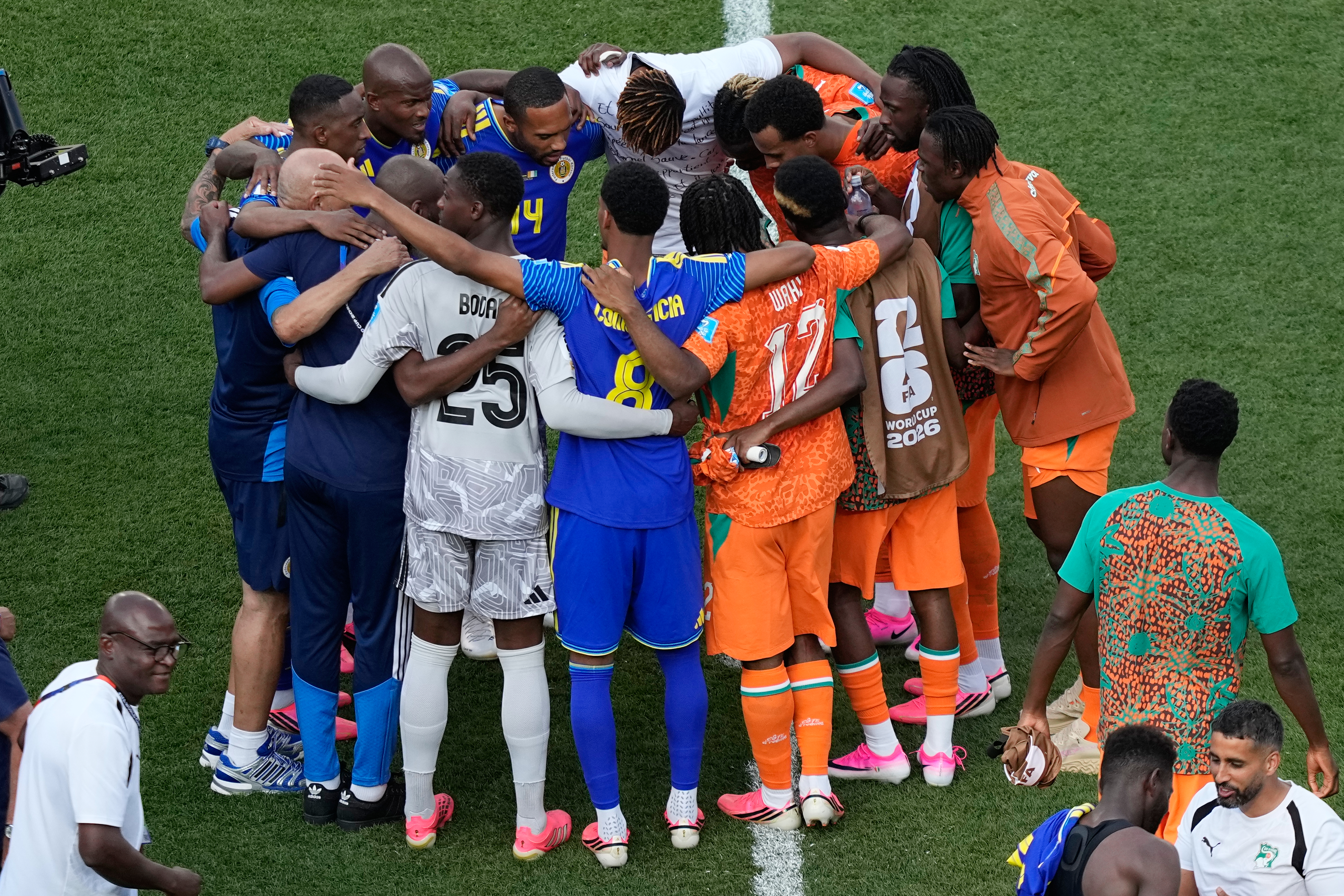 Players from Curacao and Ivory Coast huddle after the World Cup Group E soccer match between Curacao and Ivory Coast in Philadelphia, Thursday, June 25, 2026. (AP Photo/Matt Slocum)