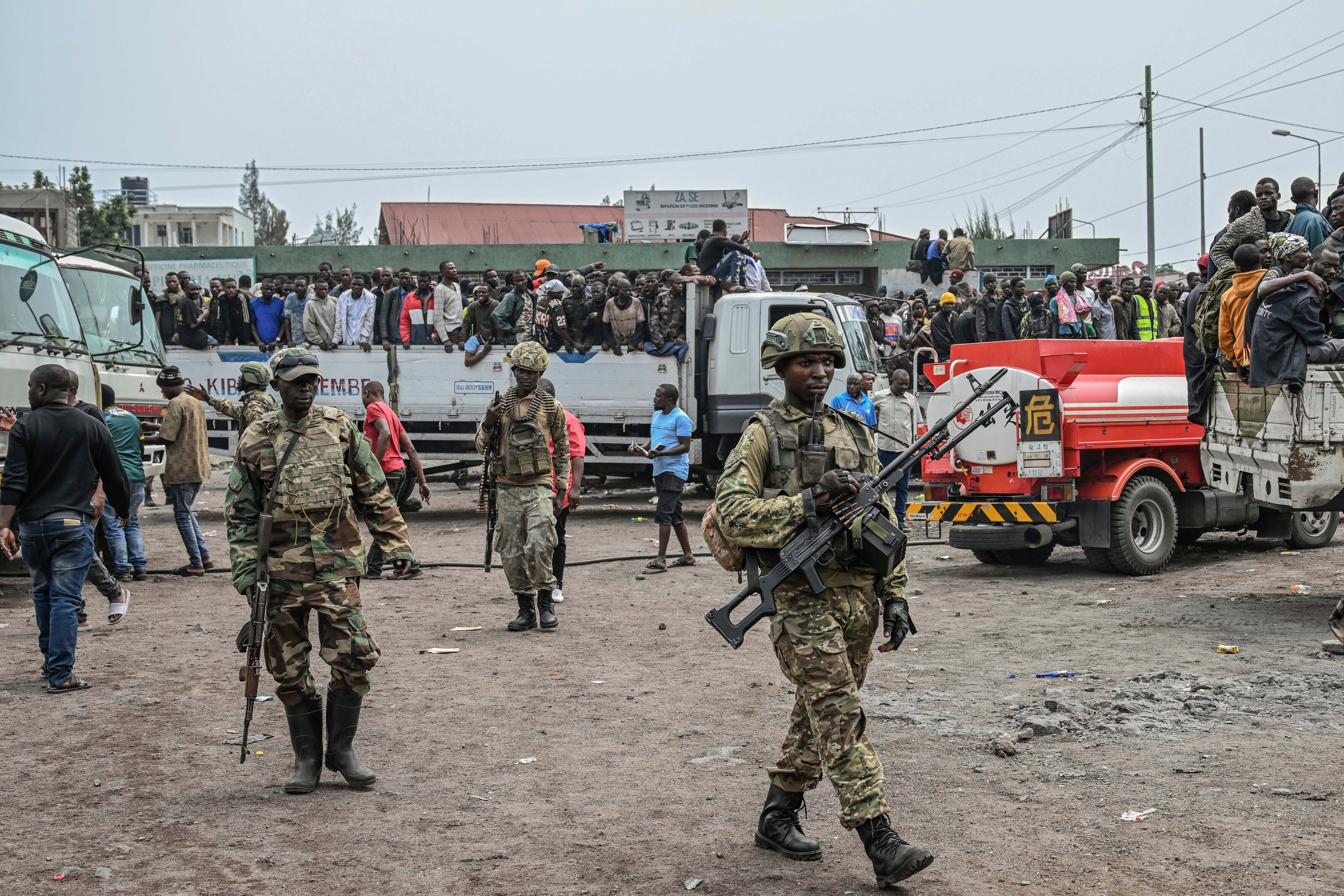 FILE - M23 rebels escort government soldiers and police who surrendered to an undisclosed location in Goma, Democratic republic of the Congo, Jan. 30, 2025. (AP Photo/Moses Sawasawa, File)
