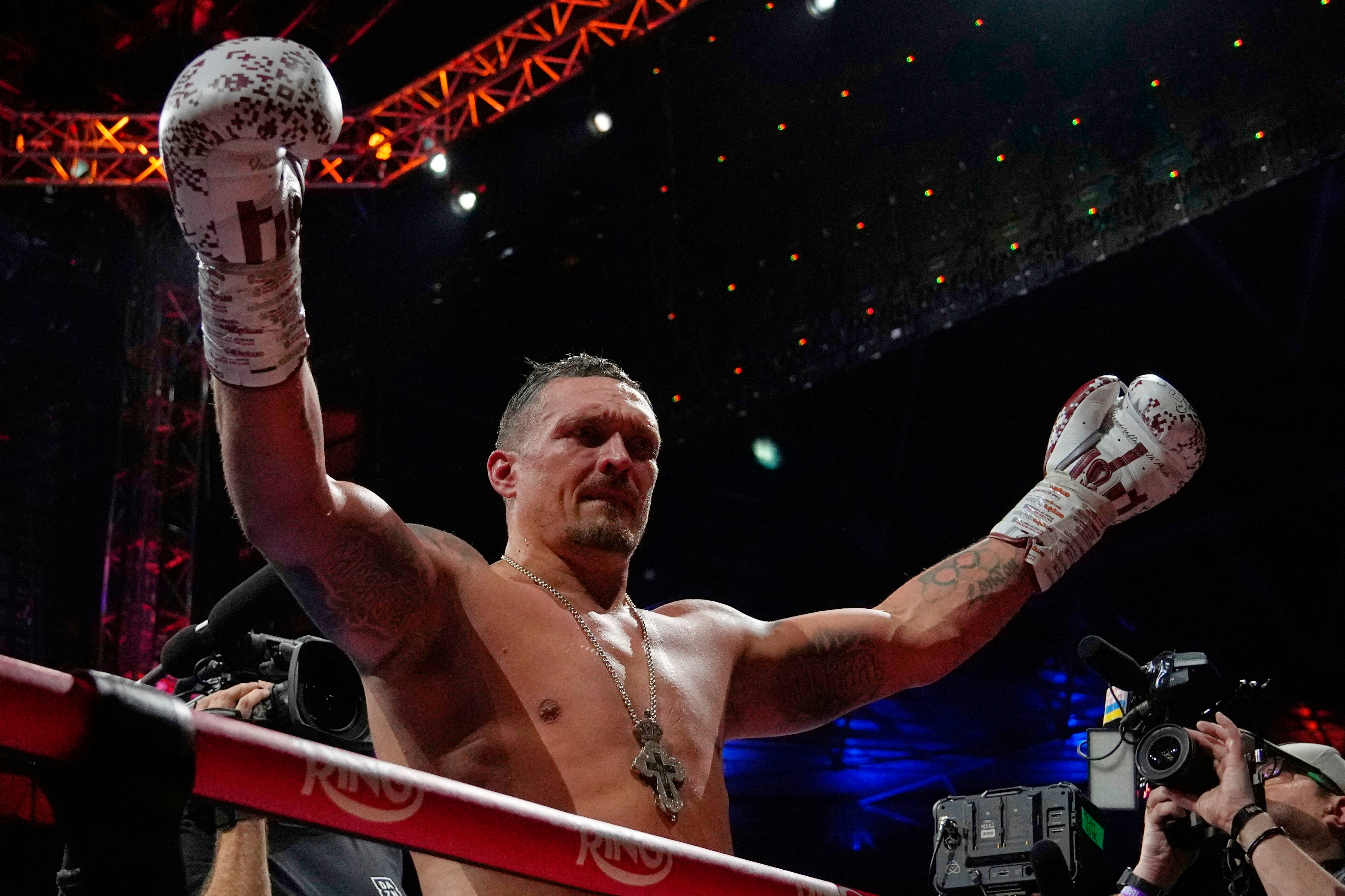 FILE - Ukraine's Oleksandr Usyk celebrates winning the undisputed world heavyweight boxing title fight against Britain's Daniel Dubois in London, July 19, 2025. (AP Photo/Frank Augstein, File)