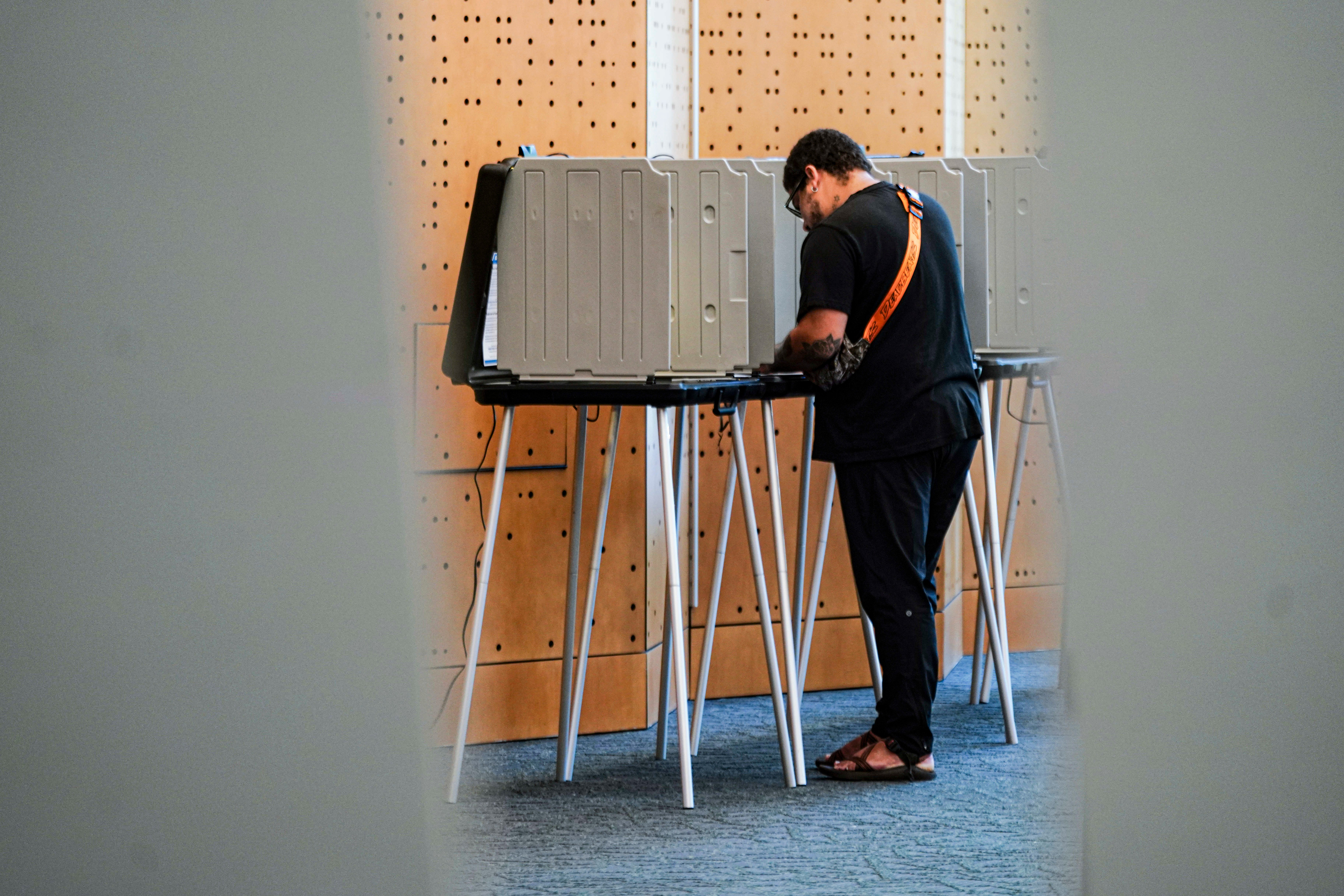 Julius Hernandez votes in the Democratic primaries at Denver Public Library, Tuesday, June 30, 2026, in Denver. (AP Photo/Rebecca Slezak)