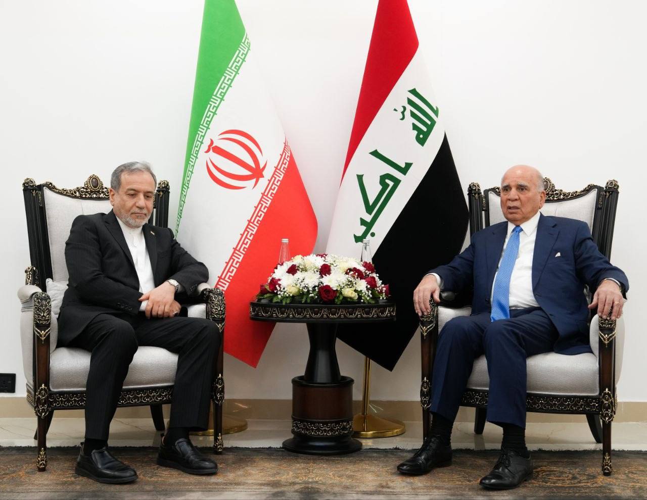 Iranian Foreign Minister Abbas Araghchi, left, in Iraq