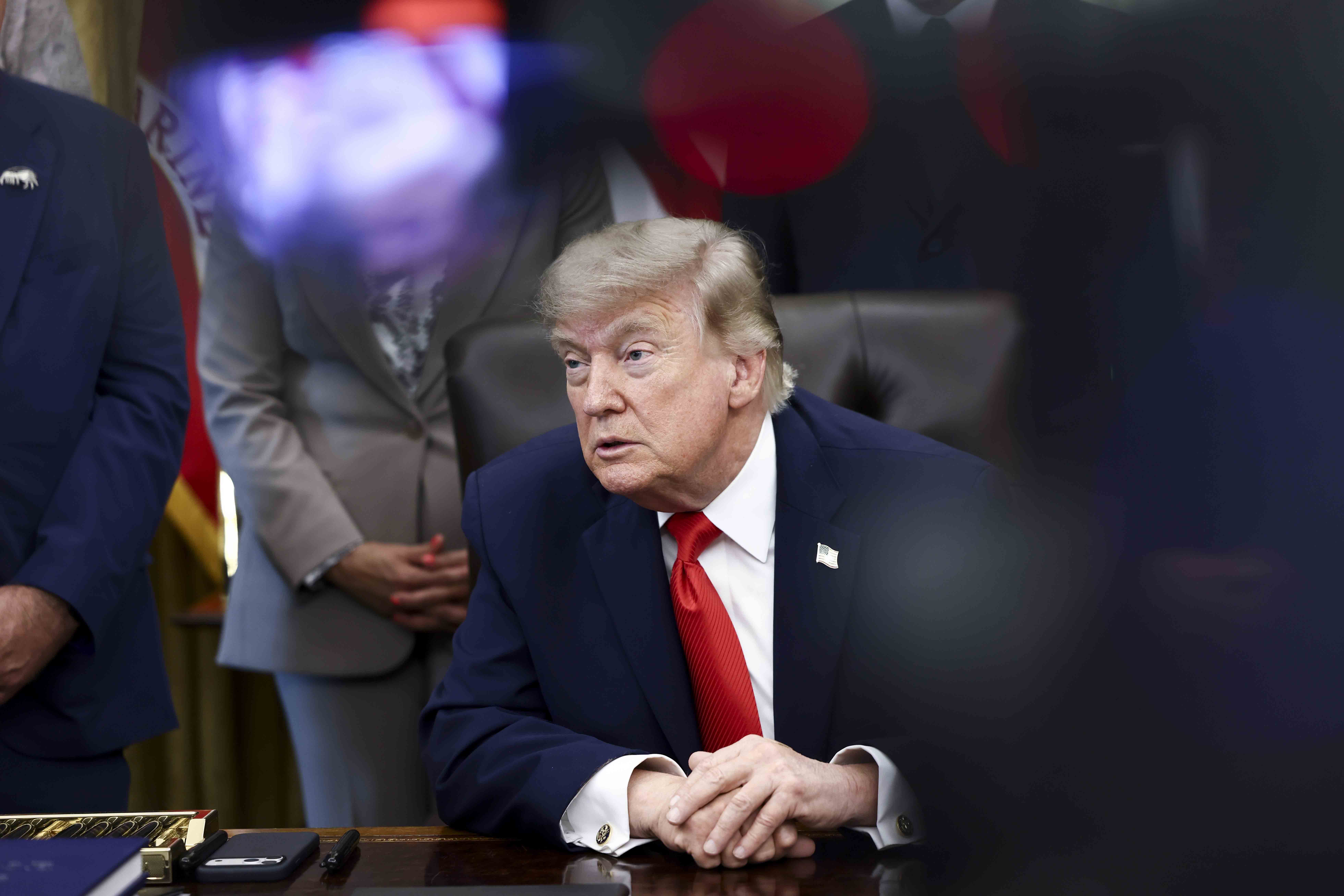 epa13031384 US President Donald Trump responds to a question from the news media after signing a fisheries proclamation in the Oval Office of the White House in Washington, DC, USA, 11 June 2026. Trump signed a proclamation opening parts of the Pacific to commercial fishing access for US-flagged vessels. EPA/JIM LO SCALZO / POOL