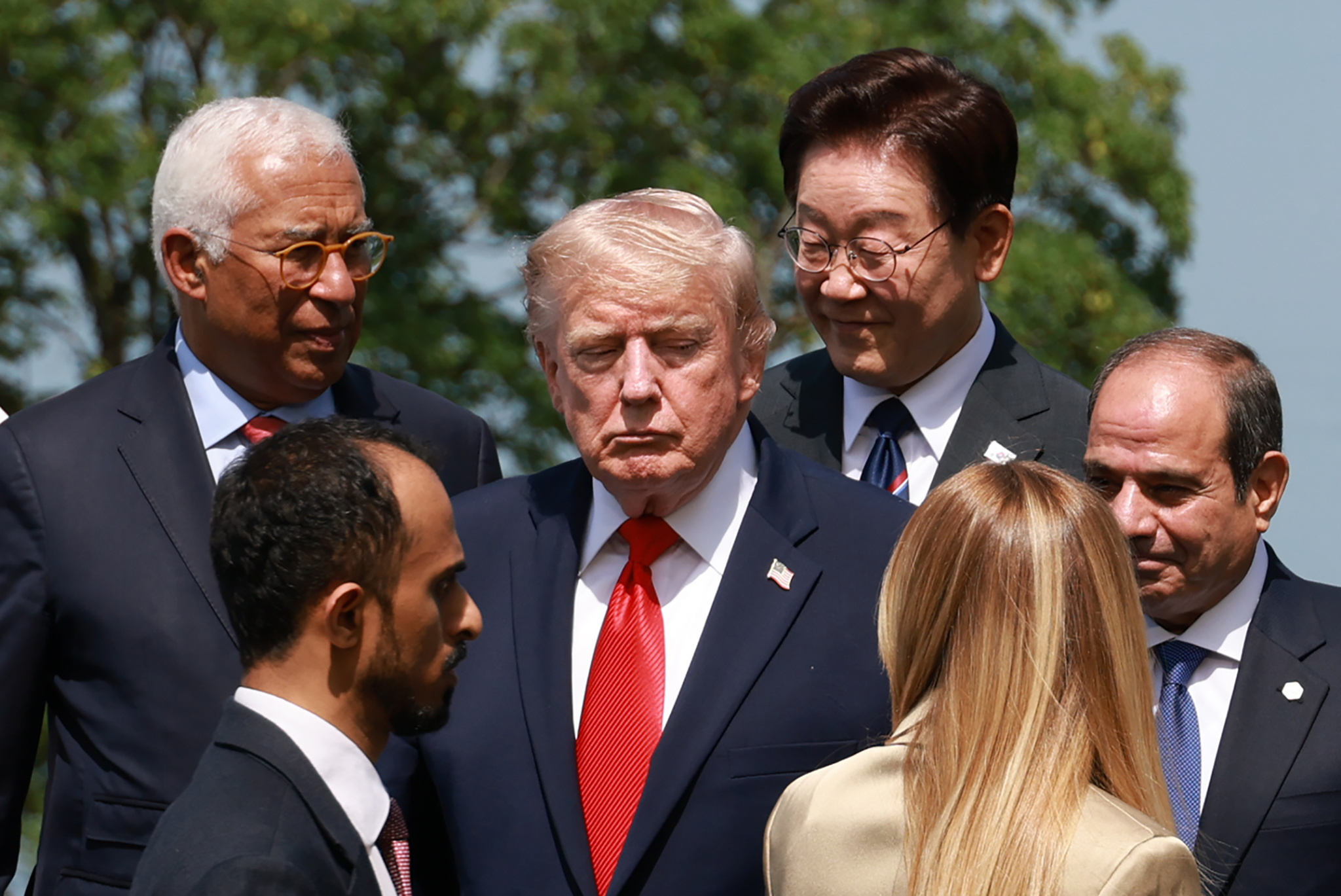 (L-R) European Council President Antonio Costa, US President Donald Trump, South Korean President Lee Jae Myung, Italy's Prime Minister Giorgia Meloni, and Egyptian President Abdel Fattah el-Sisi prepare for a group picture.