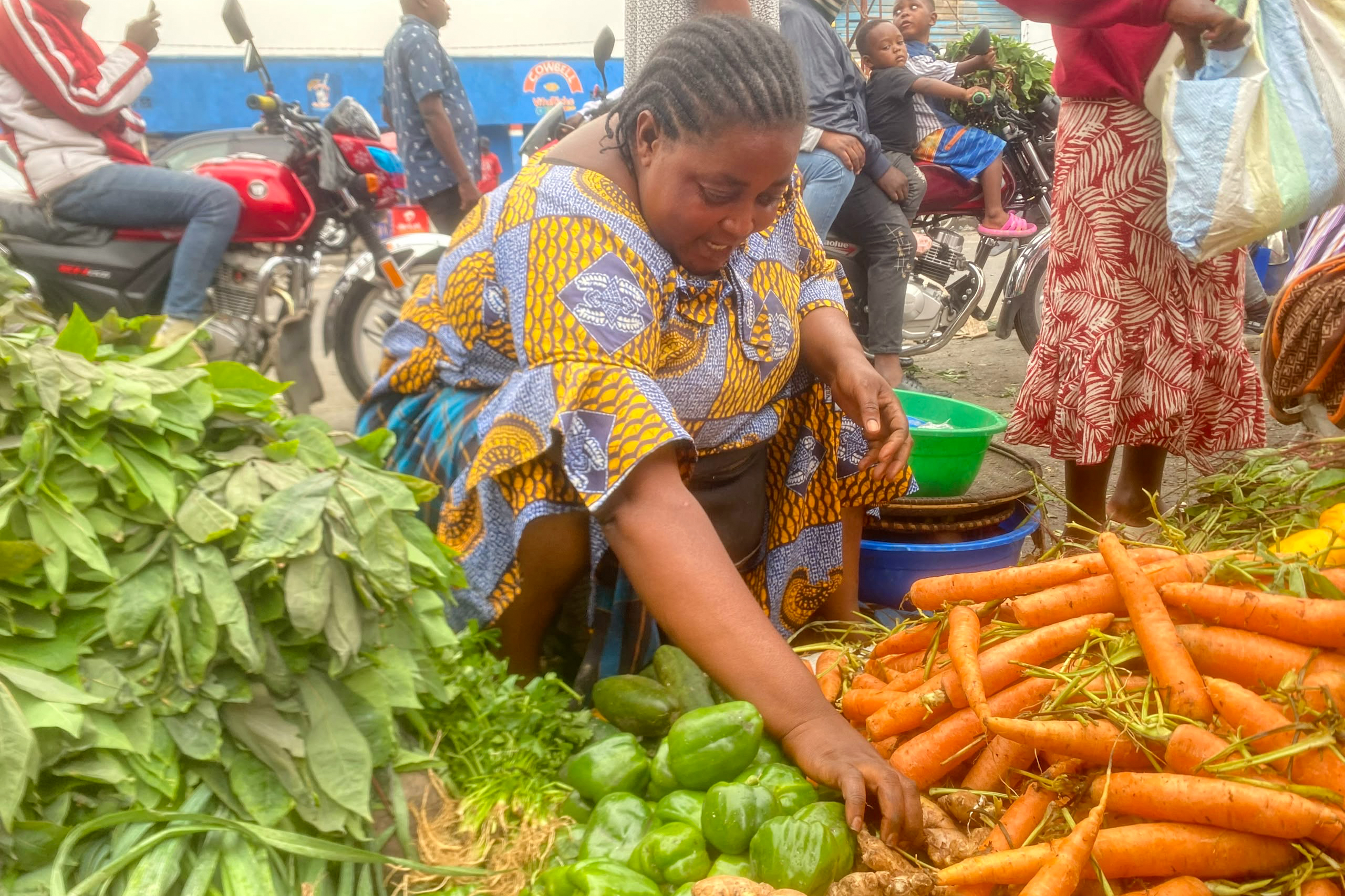 Furaha Kiza, 45, supports six children through a small vegetable-selling business [Prosper ]