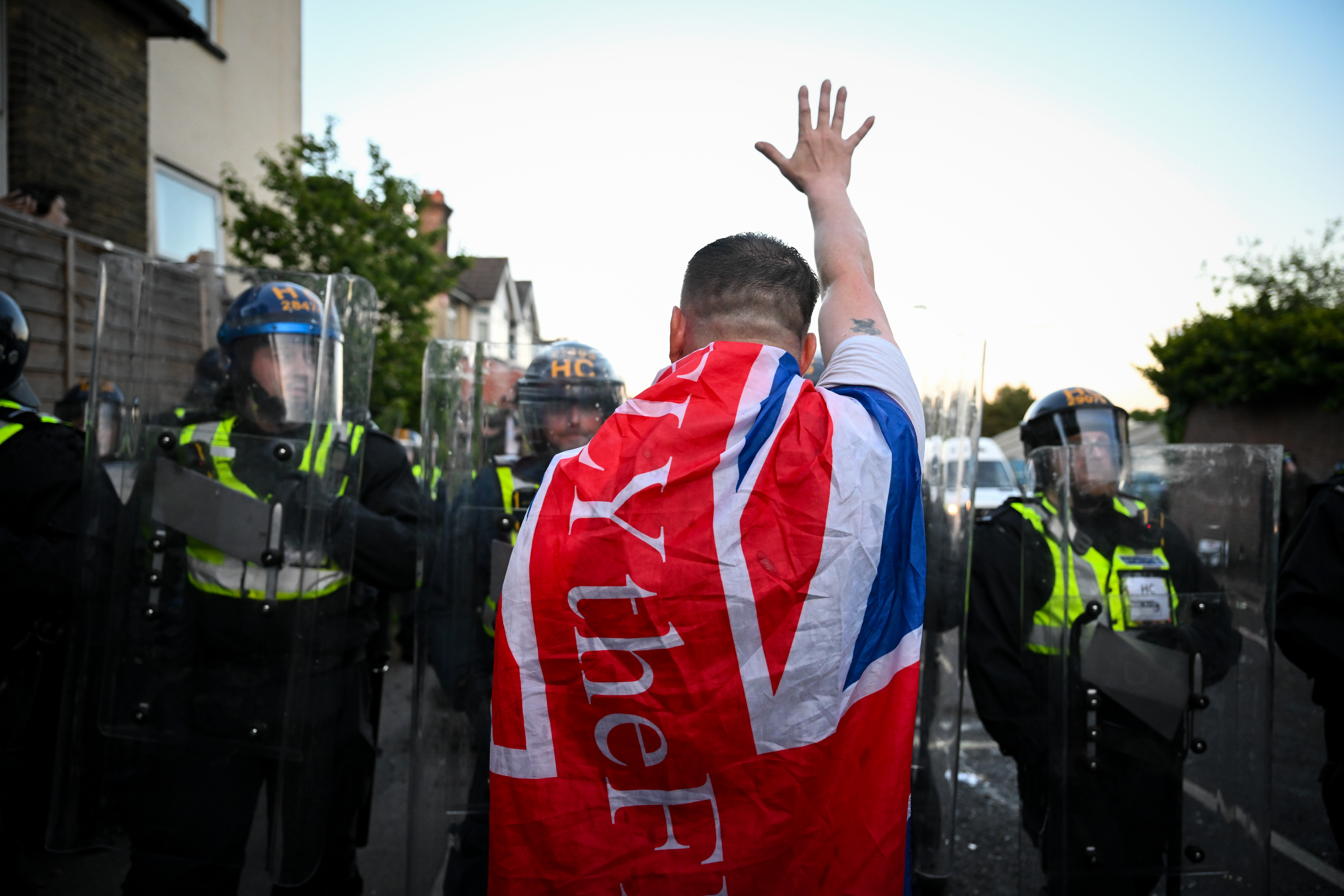 SOUTHAMPTON, ENGLAND - JUNE 02: Protestors confront riot police near the location where Henry Nowak died, during a demonstration over the police's handling of the incident, on June 02, 2026 in Southampton, England. Far-right and nationalist groups have actively organised demonstrations and vigils following revelations from the ongoing murder trial of 18-year-old student Henry Nowak. The case involves the fatal stabbing of Nowak in Southampton in December 2025 by Vickrum Digwa. Court details revealed that Digwa falsely claimed to arriving officers that he was the victim of a racist attack, leading responding police to temporarily handcuff the fatally wounded teenager before discovering his injuries. (Photo by Finnbarr Webster/Getty Images)