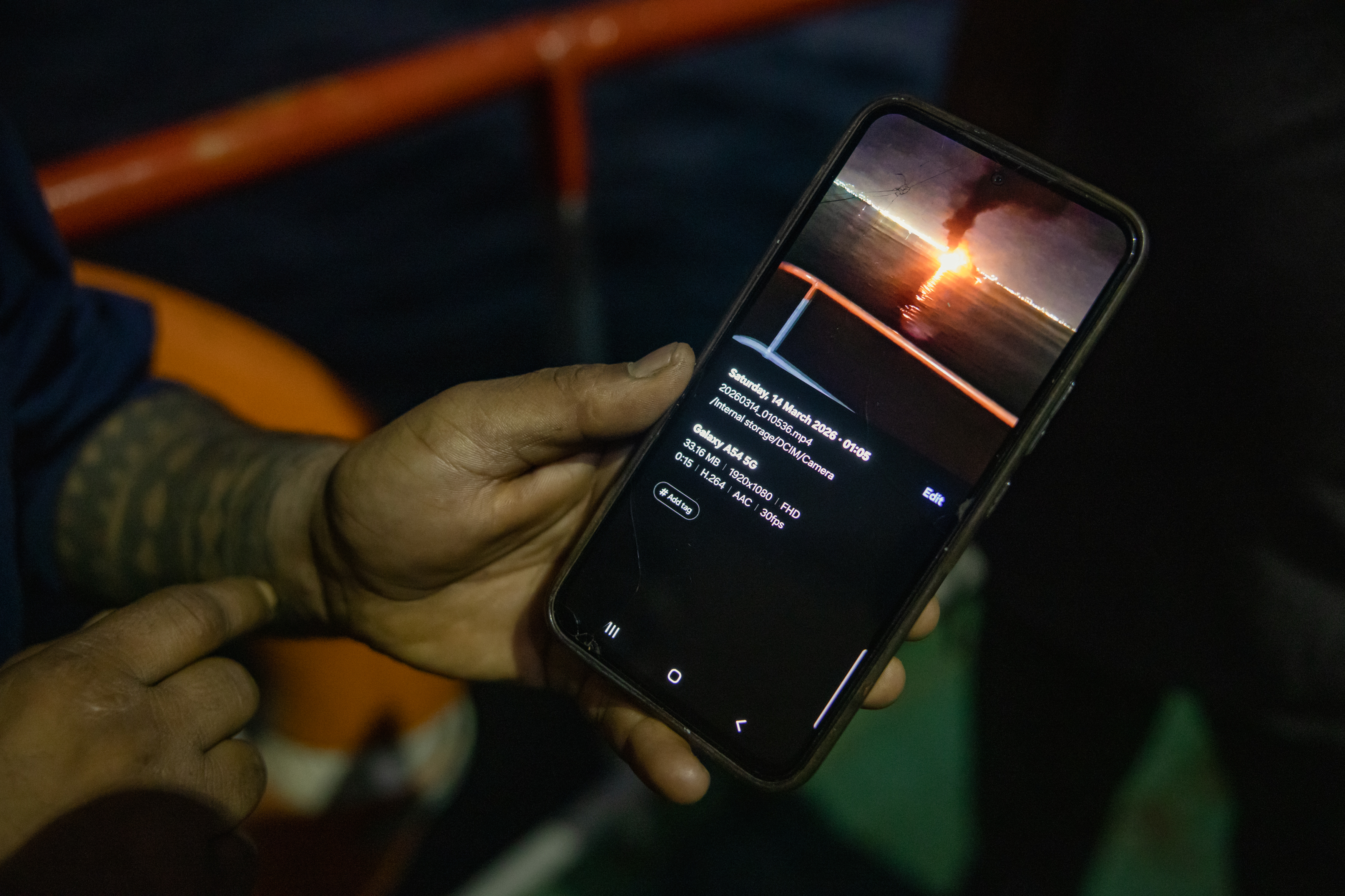 MUSCAT, OMAN - JUNE 23: An Indian sailor shows a picture on his mobile phone of an Iranian missile firing in the Strait of Hormuz on June 23, 2026 in Muscat, Oman. The Strait of Hormuz, a vital shipping route for the region's oil and gas, was effectively blockaded since the outbreak of war between the United States and Iran in late February. This week's provisional peace deal between the countries was meant to reopen the waterway to shipping traffic, but the pace of that reopening is unclear amid continued fighting in Lebanon and the need to clear the Strait of sea mines. On Sunday, U.S. Vice President JD Vance arrived in Switzerland for high-level talks with the Iranian delegation, as the two sides seek to clarify the terms of ending the war. (Photo by Elke Scholiers/Getty Images)