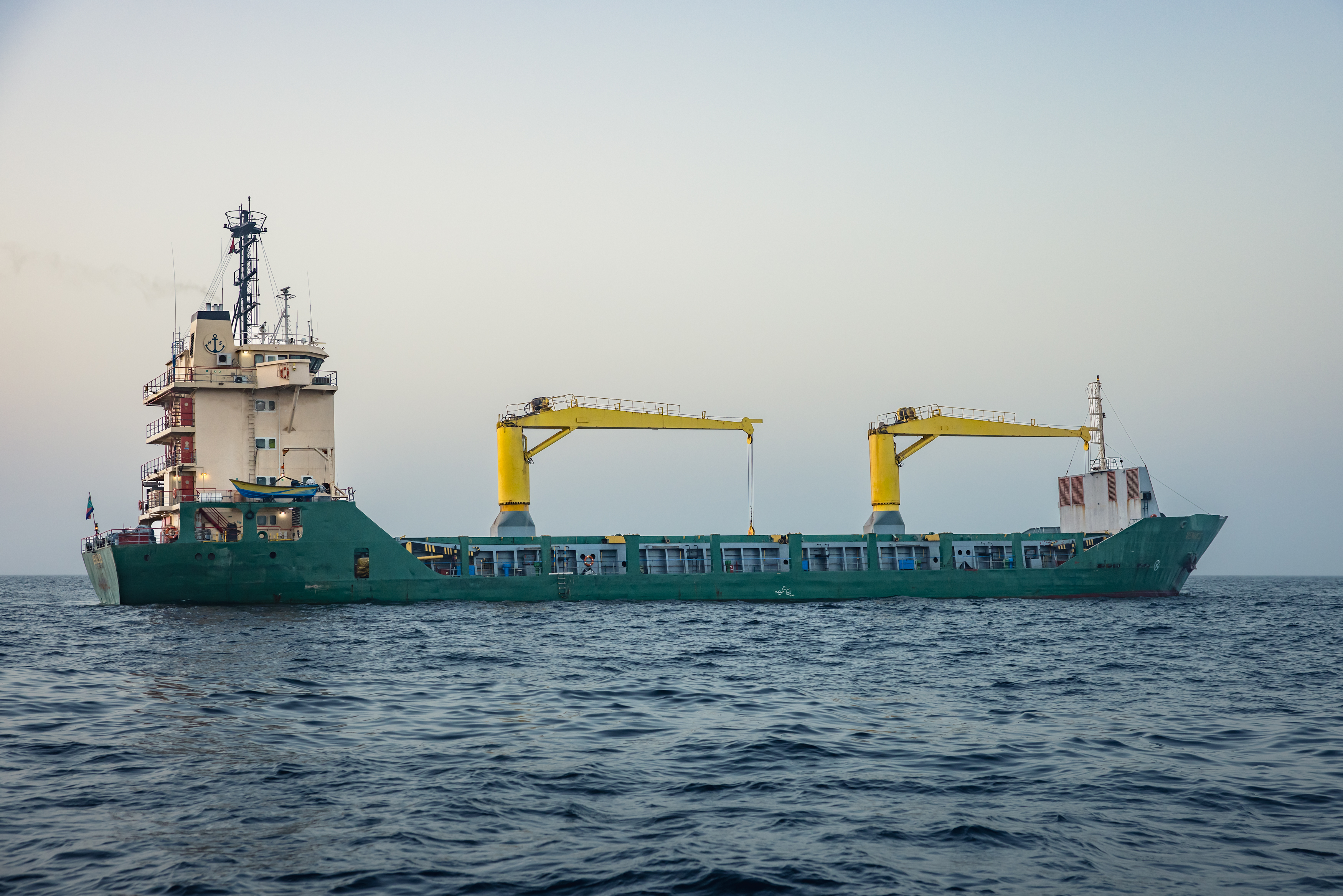 MUSCAT, OMAN - JUNE 23: A cargo vessel is anchored off the coast of Oman after being stranded for days as congestion at Port Sultan Qaboos has prevented them from docking on June 23, 2026 in Muscat, Oman. The Strait of Hormuz, a vital shipping route for the region's oil and gas, was effectively blockaded since the outbreak of war between the United States and Iran in late February. This week's provisional peace deal between the countries was meant to reopen the waterway to shipping traffic, but the pace of that reopening is unclear amid continued fighting in Lebanon and the need to clear the Strait of sea mines. On Sunday, U.S. Vice President JD Vance arrived in Switzerland for high-level talks with the Iranian delegation, as the two sides seek to clarify the terms of ending the war. (Photo by Elke Scholiers/Getty Images)