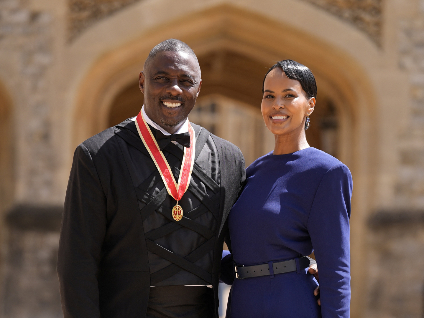 Sir Idris Elba, activist, actor and musician, poses with his wife Sabrina Dhowre Elba, after being made a Knight Bachelor by King Charles III at Windsor Castle, Windsor, Britain on June 2, 2026. [Andrew Matthews/Reuters]
