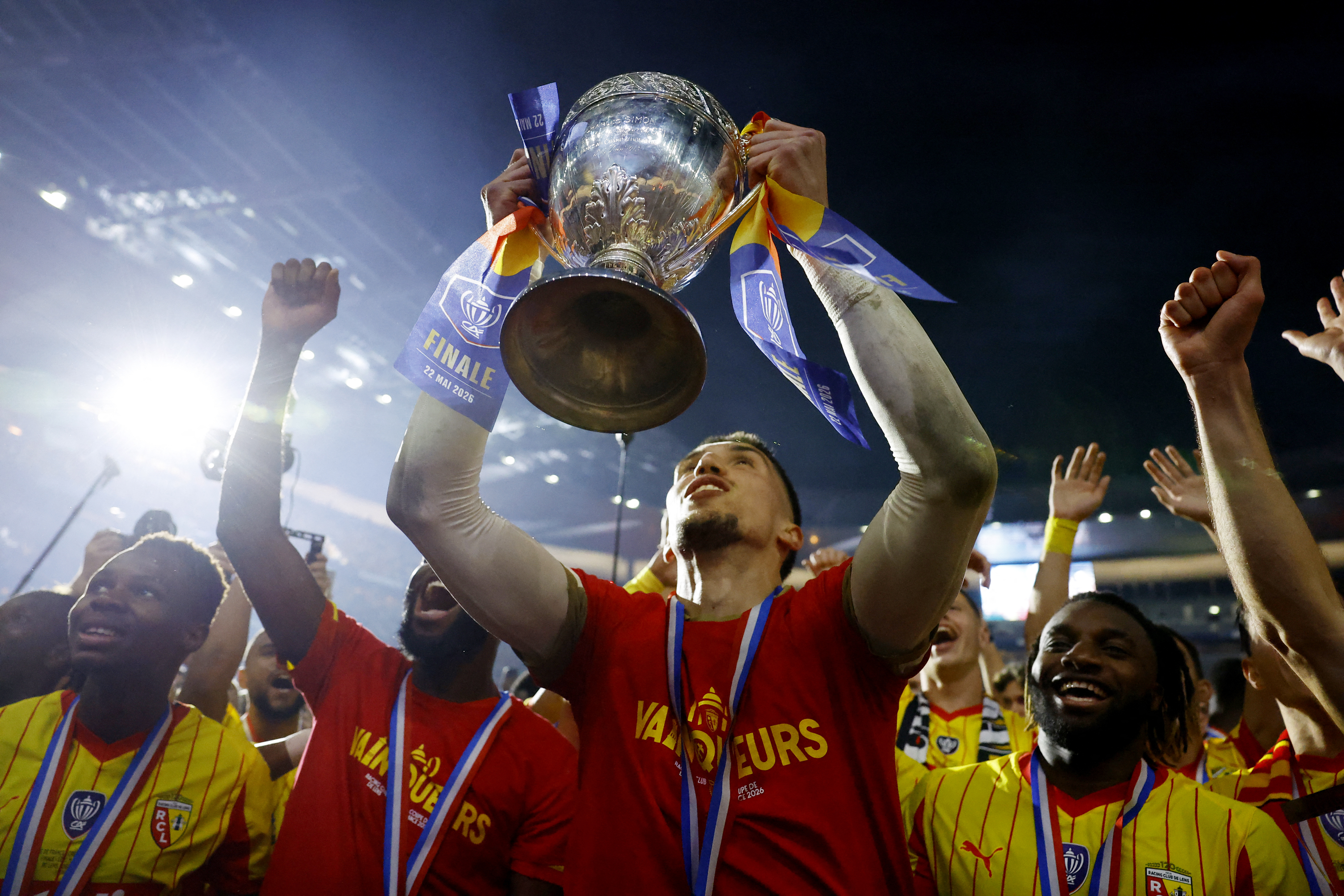 Soccer Football - Coupe de France - Final - RC Lens v OGC Nice - Stade de France, Saint Denis, France - May 22, 2026 RC Lens' Robin Risser celebrates with the trophy after winning the Coupe de France REUTERS/Stephanie Lecocq