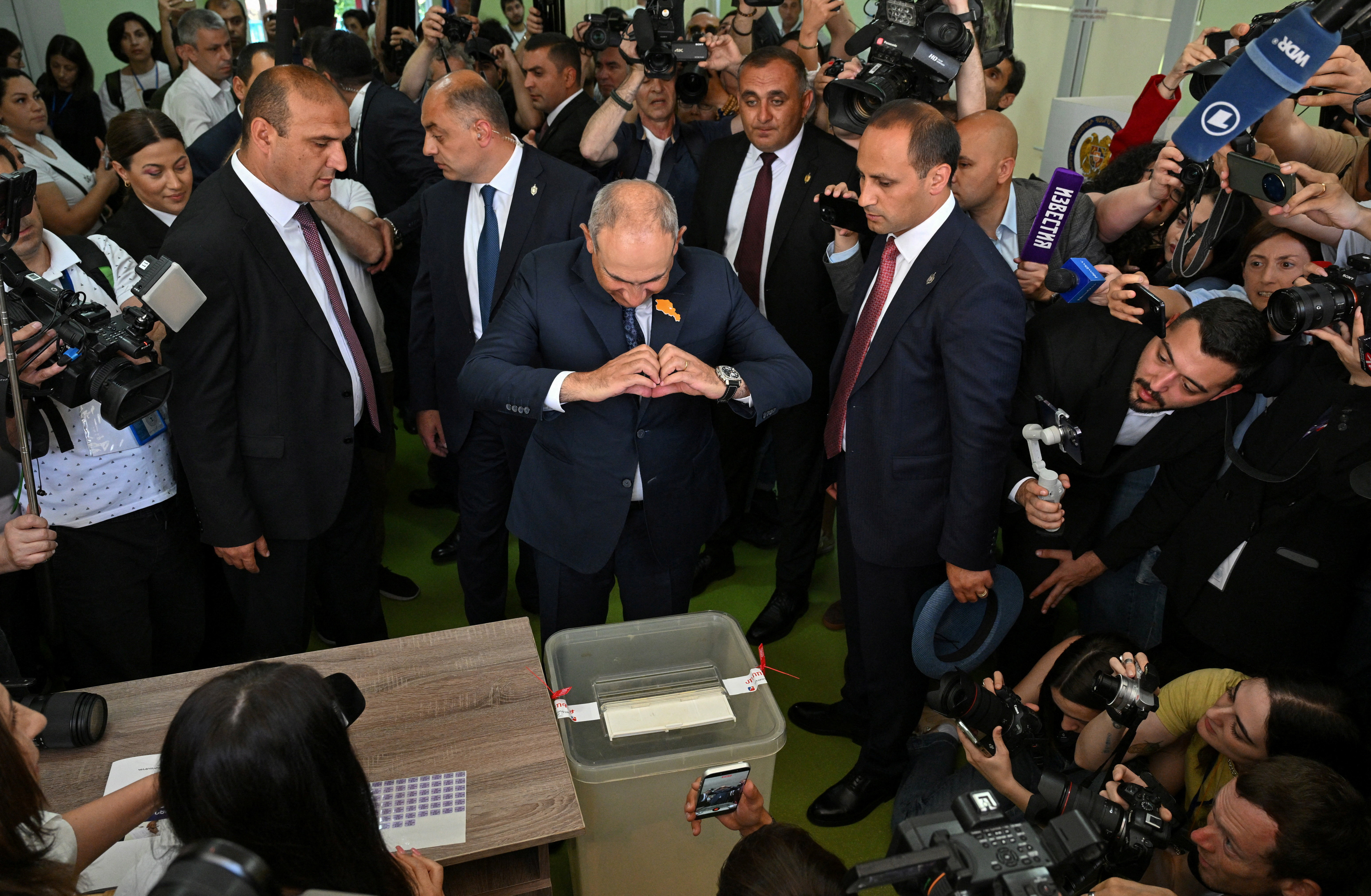 Armenian Prime Minister and leader of the Civil Contract party Nikol Pashinyan gestures after casting a ballot at a polling station during a parliamentary election in Yerevan, Armenia, June 7, 2026. Stringer/Photolure via REUTERS ATTENTION EDITORS - THIS IMAGE HAS BEEN SUPPLIED BY A THIRD PARTY.