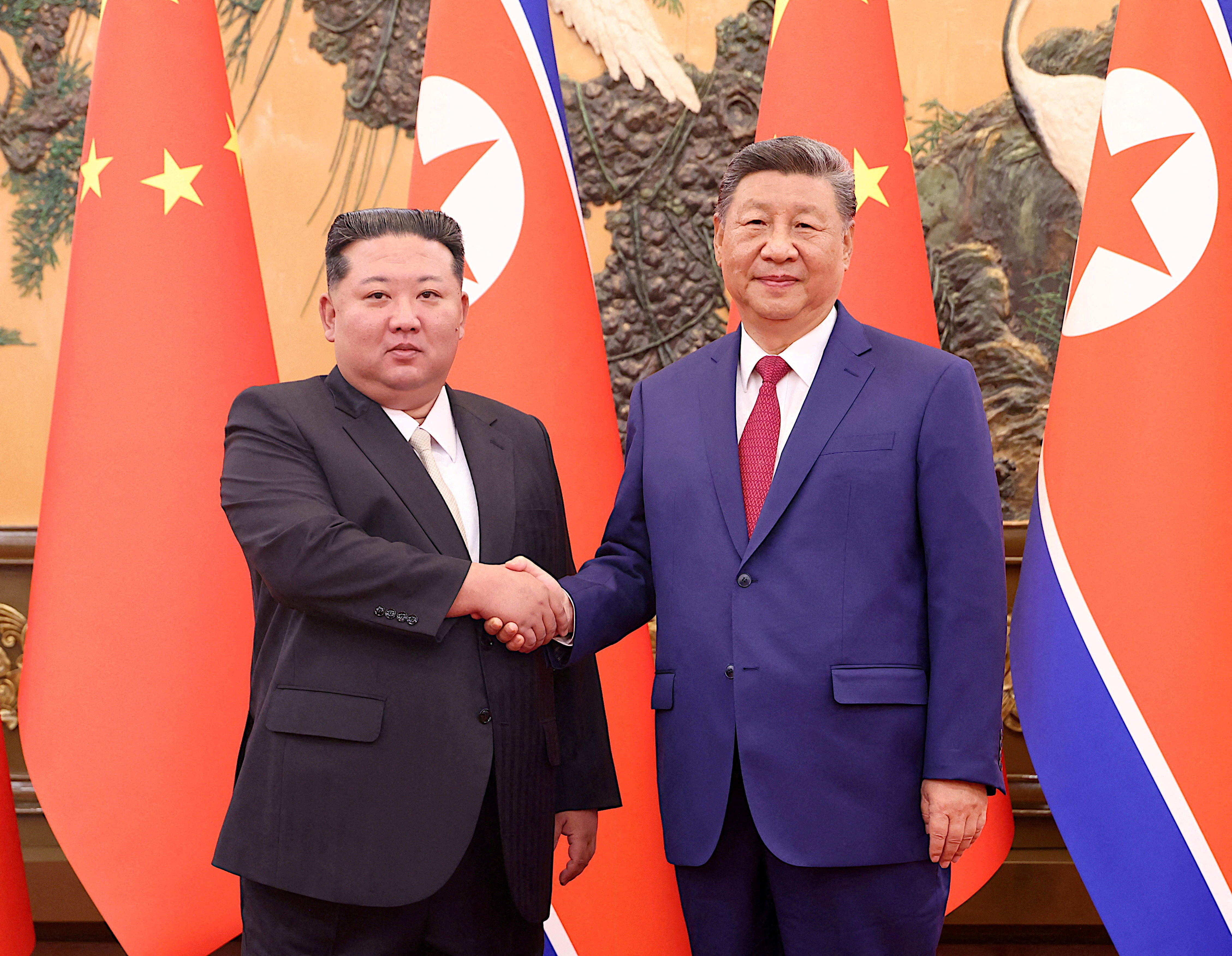 FILE PHOTO: Chinese President Xi Jinping and Democratic People's Republic of Korea (DPRK) leader Kim Jong Un shake hands at the Great Hall of the People in Beijing, China September 4, 2025. China Daily via REUTERS ATTENTION EDITORS - THIS IMAGE WAS PROVIDED BY A THIRD PARTY. CHINA OUT./File Photo