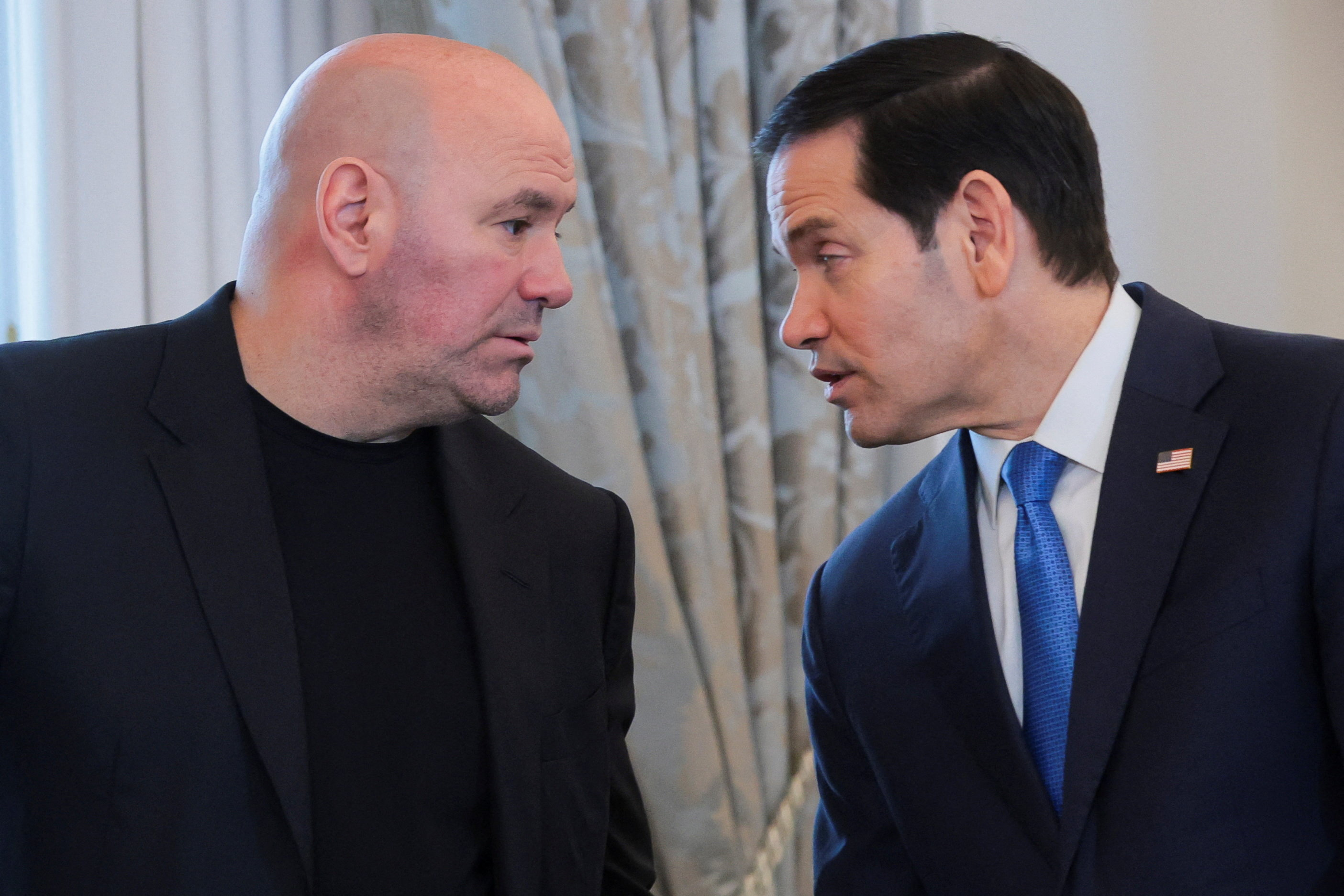 U.S. Secretary of State Marco Rubio speaks with UFC CEO Dana White as they attend to deliver remarks before signing a memorandum of understanding at a reception at the State Department in Washington, D.C., U.S., June 11, 2026. REUTERS/Jonathan Ernst