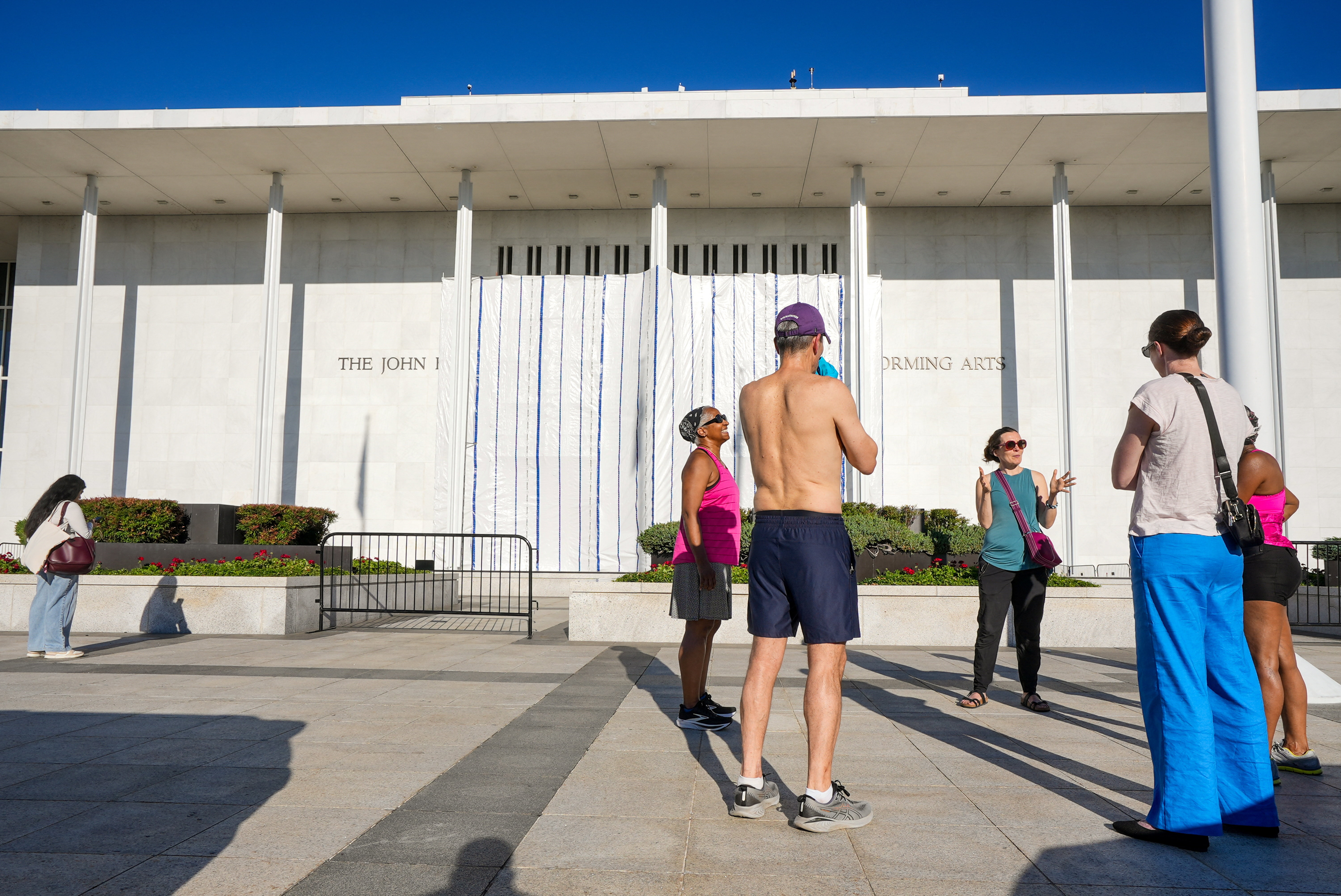 The scaffolding with a tarp remains after the removal of the lettering early this morning from the facade of the John F. Kennedy Memorial Center for the Performing Arts, following a federal judge's order to remove U.S. President Donald Trump's name from the institution, in Washington, D.C., U.S., June 13, 2026. REUTERS/Ken Cedeno