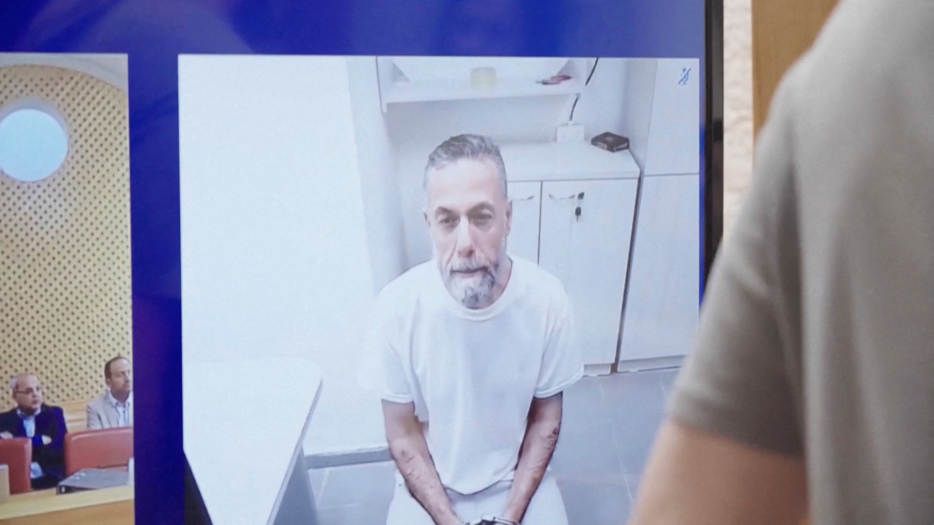 Palestinian doctor Hussam Abu Safiya, who was arrested by the Israeli military in Gaza in late 2024 and still held in prison, appears via video link at the Israeli Supreme Court hearing in Jerusalem