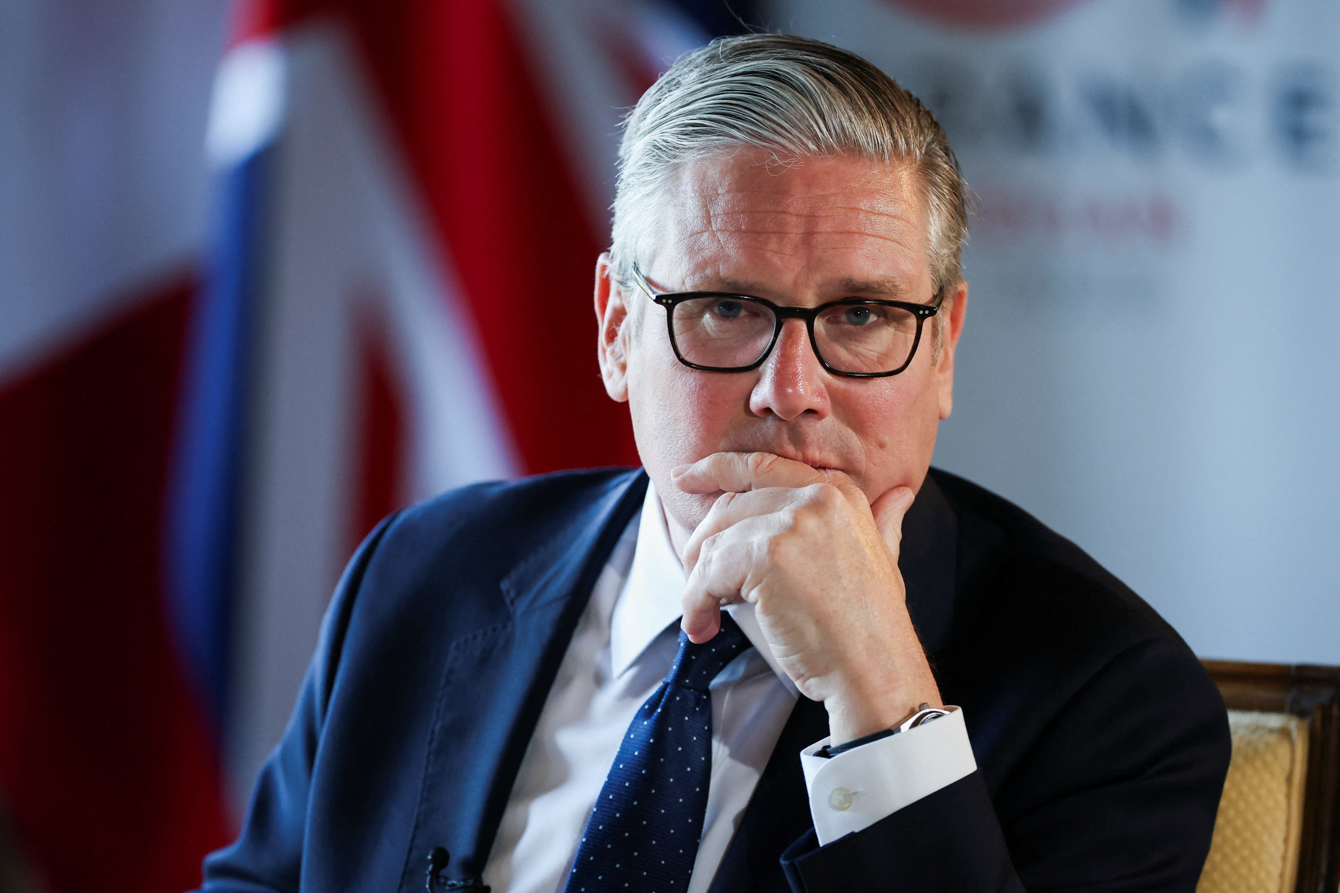 UK Prime Minister Keir Starmer looks on as he speaks to the members of the media on the sidelines of the G7 summit in France