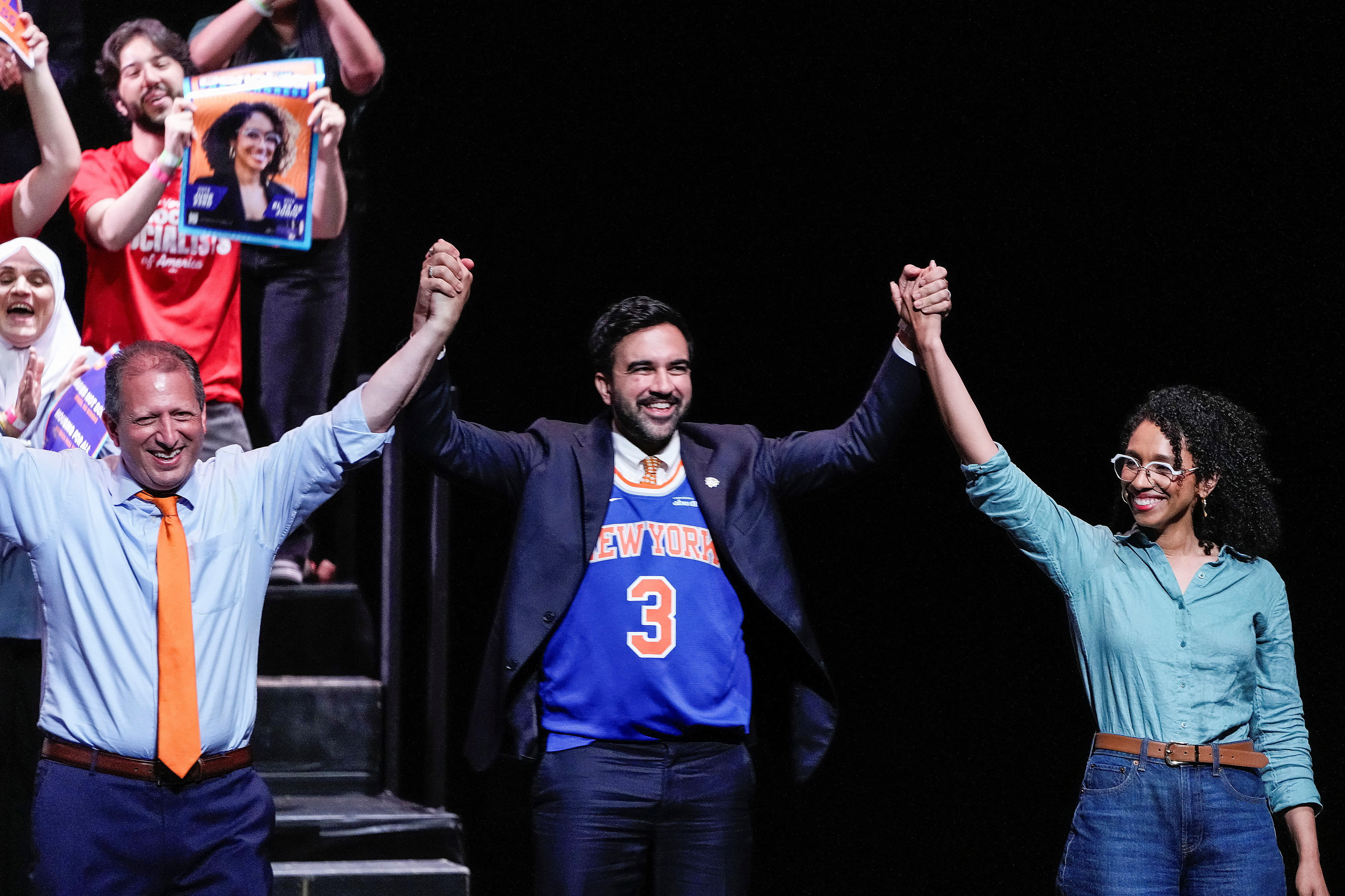 New York City Mayor Zohran Mamdani holds up hands with Brad Lander and Darializa Avila during a Get Out the Vote rally in Brooklyn, New York, U.S., June 18, 2026. REUTERS/Eduardo Munoz