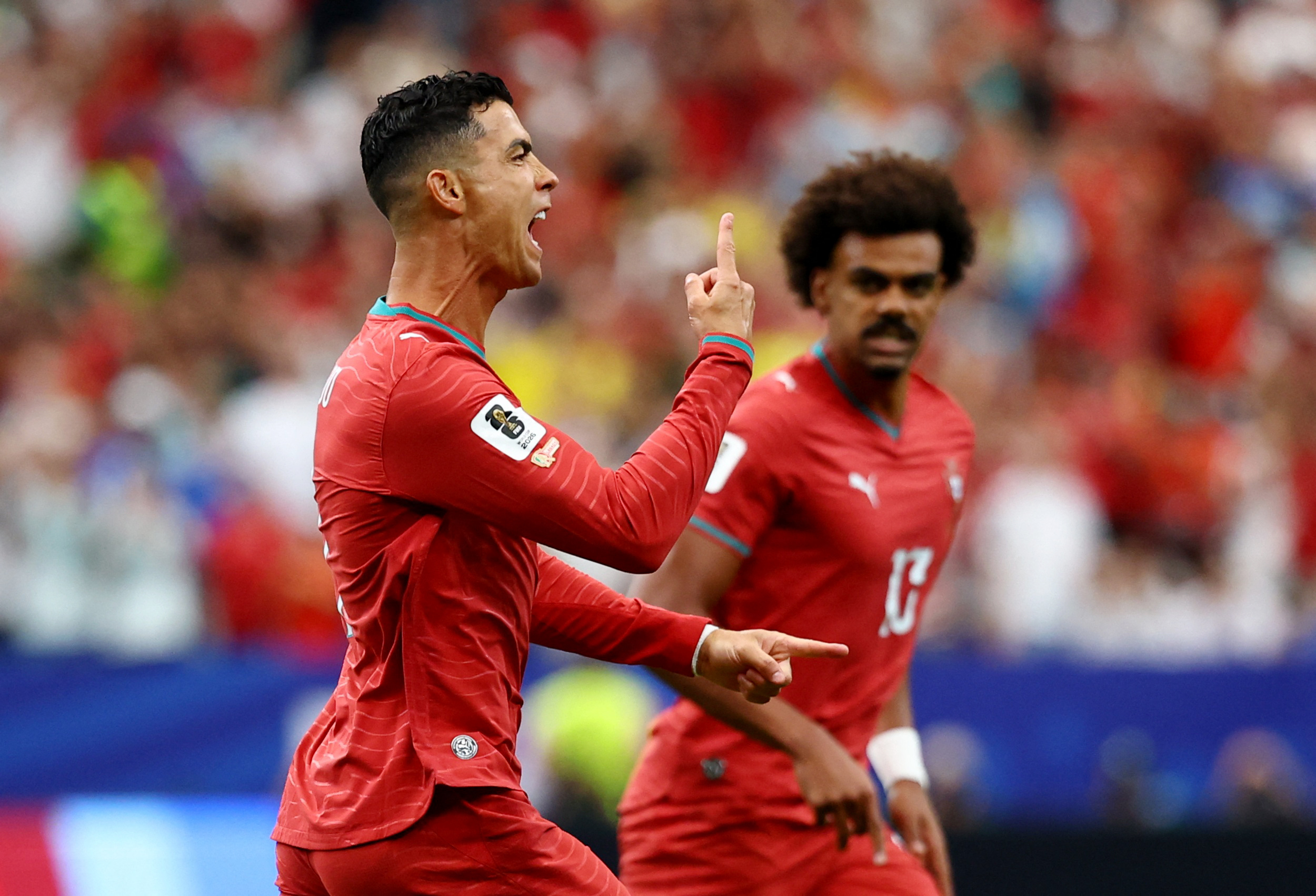 Soccer Football - FIFA World Cup 2026 - Group K - Portugal v Uzbekistan - Houston Stadium, Houston, Texas, U.S. - June 23, 2026 Portugal's Cristiano Ronaldo celebrates scoring their first goal with Renato Veiga REUTERS/Pedro Nunes