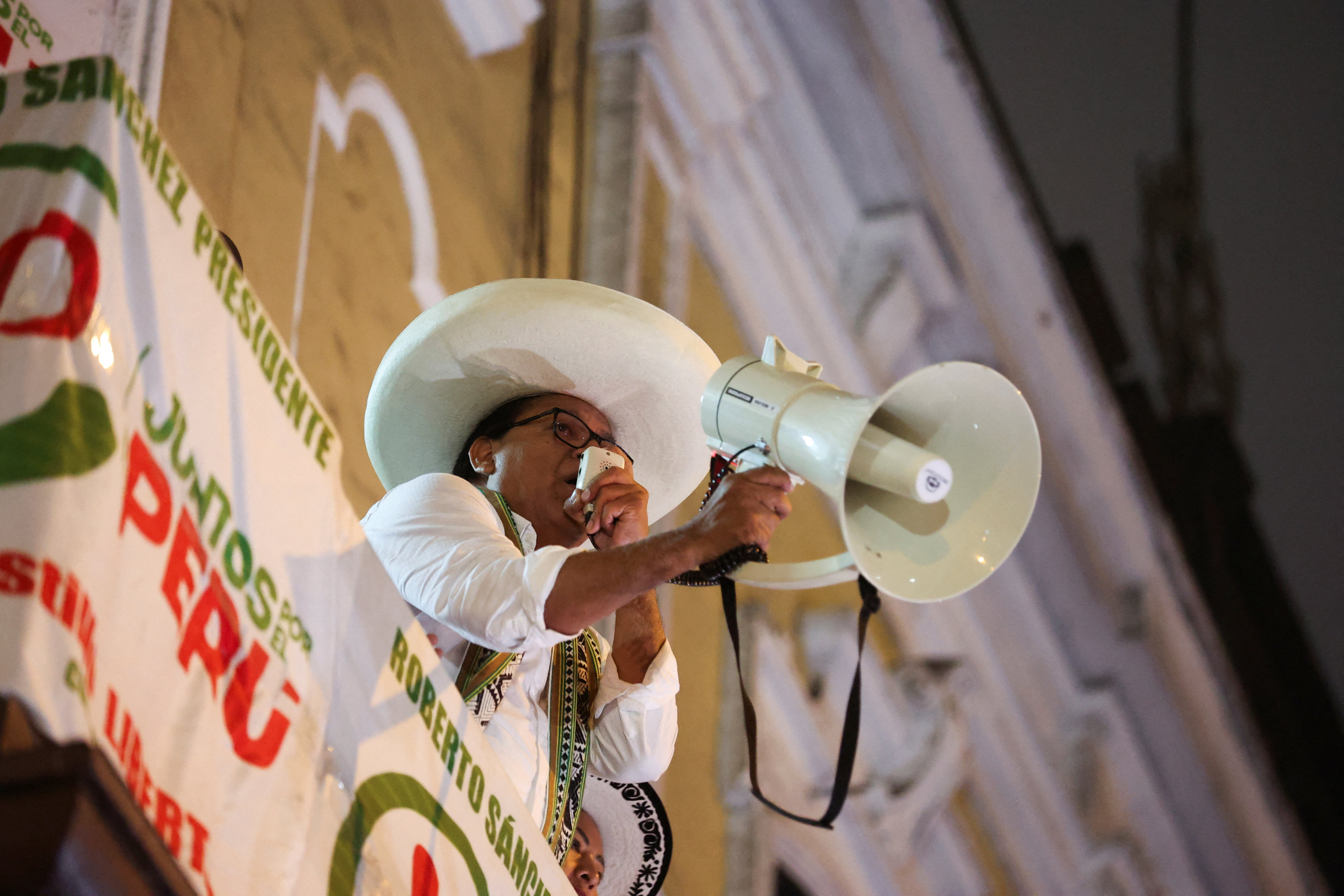 Peru's left-wing presidential candidate Roberto Sanchez uses a megaphone to address supporters during a protest, after he alleged irregularities at the electoral authority, in Lima, Peru, June 19, 2026. REUTERS/Alessandro Cinque