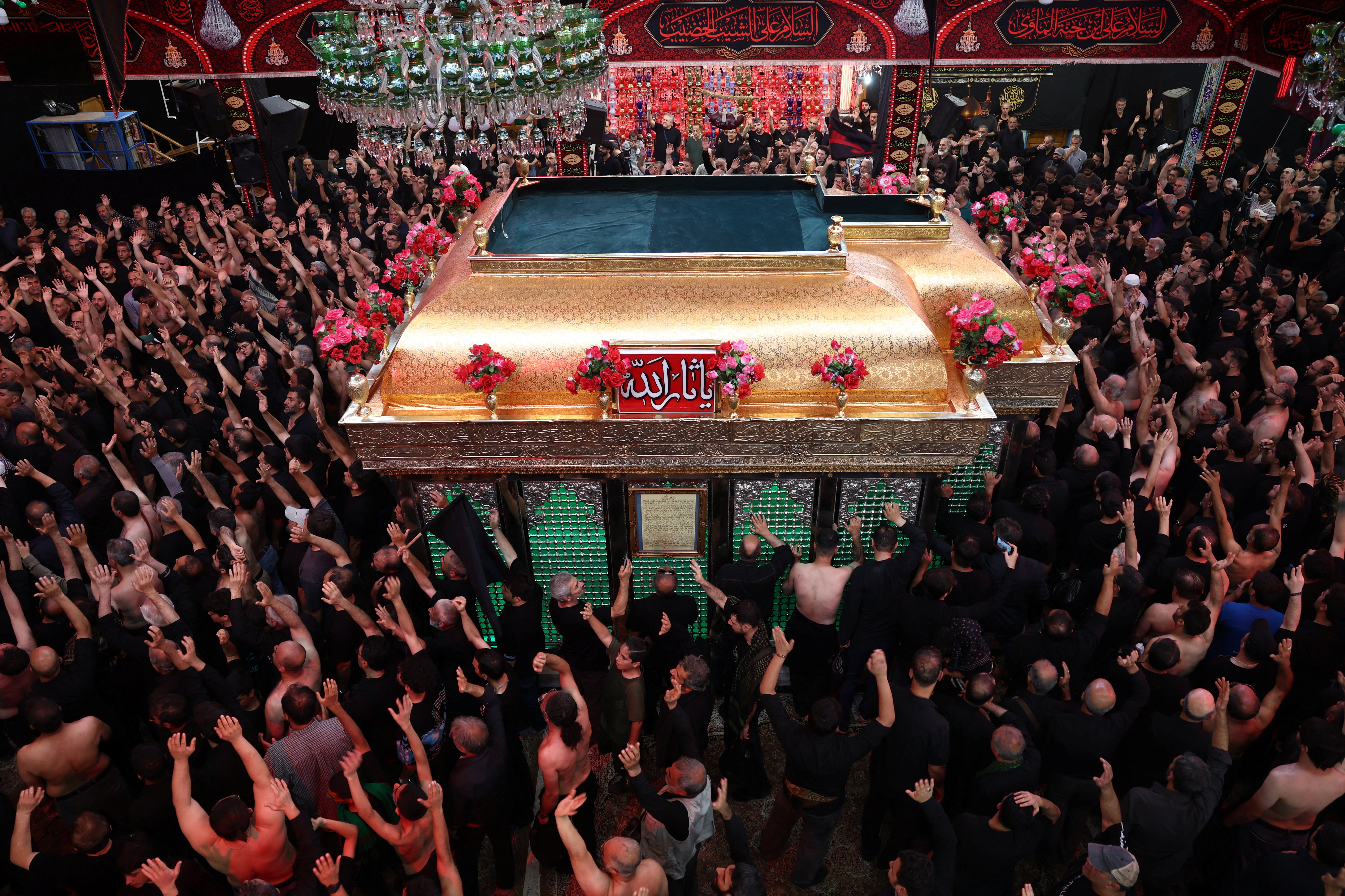 Iranian Shi'ite Muslims mourn during a ceremony to mark Ashura, the holiest day on the Shi'ite Muslim calendar, in Tehran, Iran June 25, 2026. Majid Asgaripour/WANA (West Asia News Agency) via REUTERS ATTENTION EDITORS - THIS IMAGE HAS BEEN SUPPLIED BY A THIRD PARTY. ATTENTION EDITORS - THIS PICTURE WAS PROVIDED BY A THIRD PARTY. ISRAEL OUT. NO COMMERCIAL OR EDITORIAL SALES IN ISRAEL. NO ACCESS FOR ISRAELI MEDIA. NO USE BBC PERSIAN. NO USE VOA PERSIAN. NO USE MANOTO. NO USE IRAN INTERNATIONAL. NO USE RADIO FARDA. DIGITAL: NO USE BBC PERSIAN. NO USE VOA PERSIAN. NO USE MANOTO. NO USE IRAN INTERNATIONAL. NO USE RADIO FARDA.