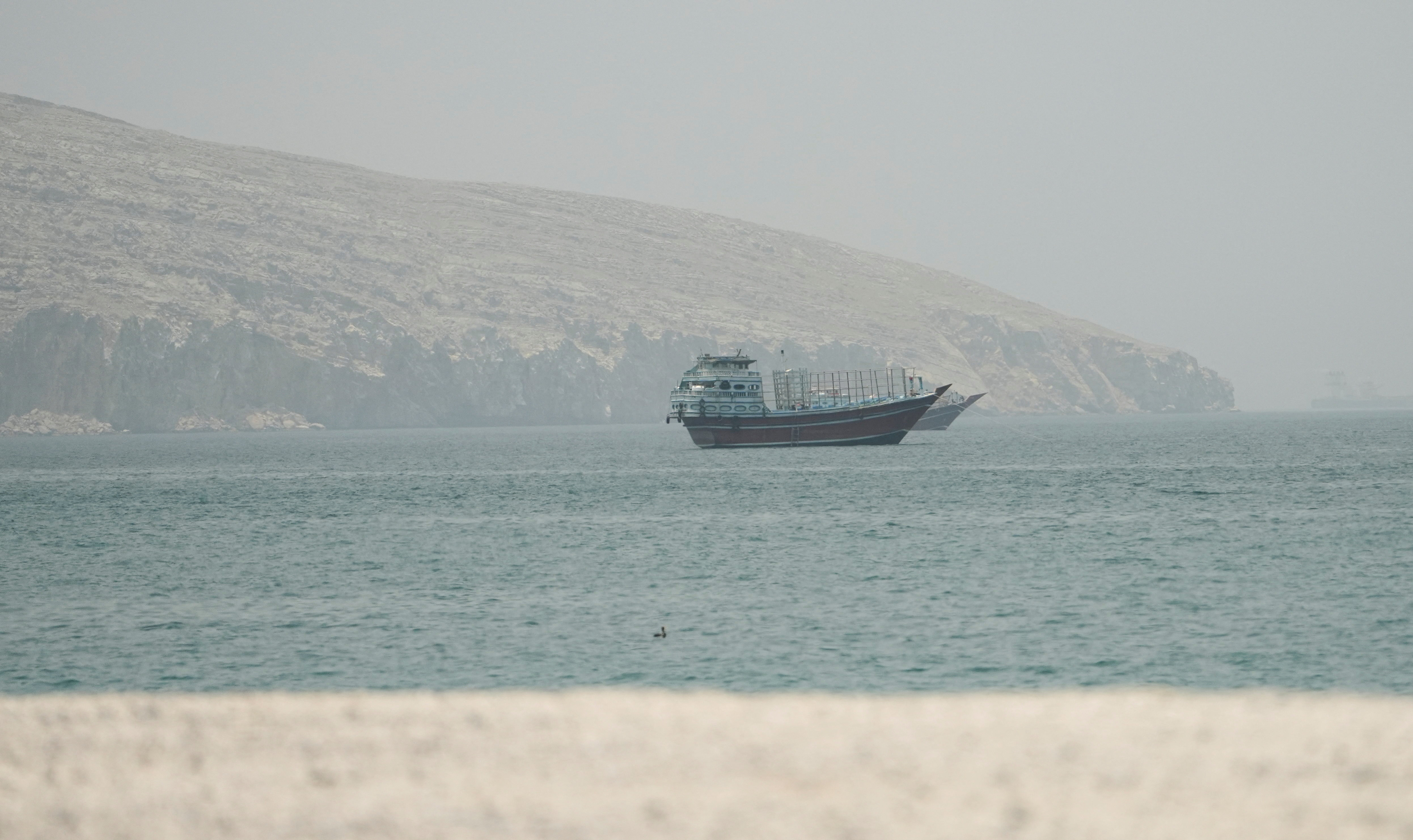 Vessels at the Strait of Hormuz, as seen from Musandam, Oman, June 24, 2026. REUTERS/Stringer
