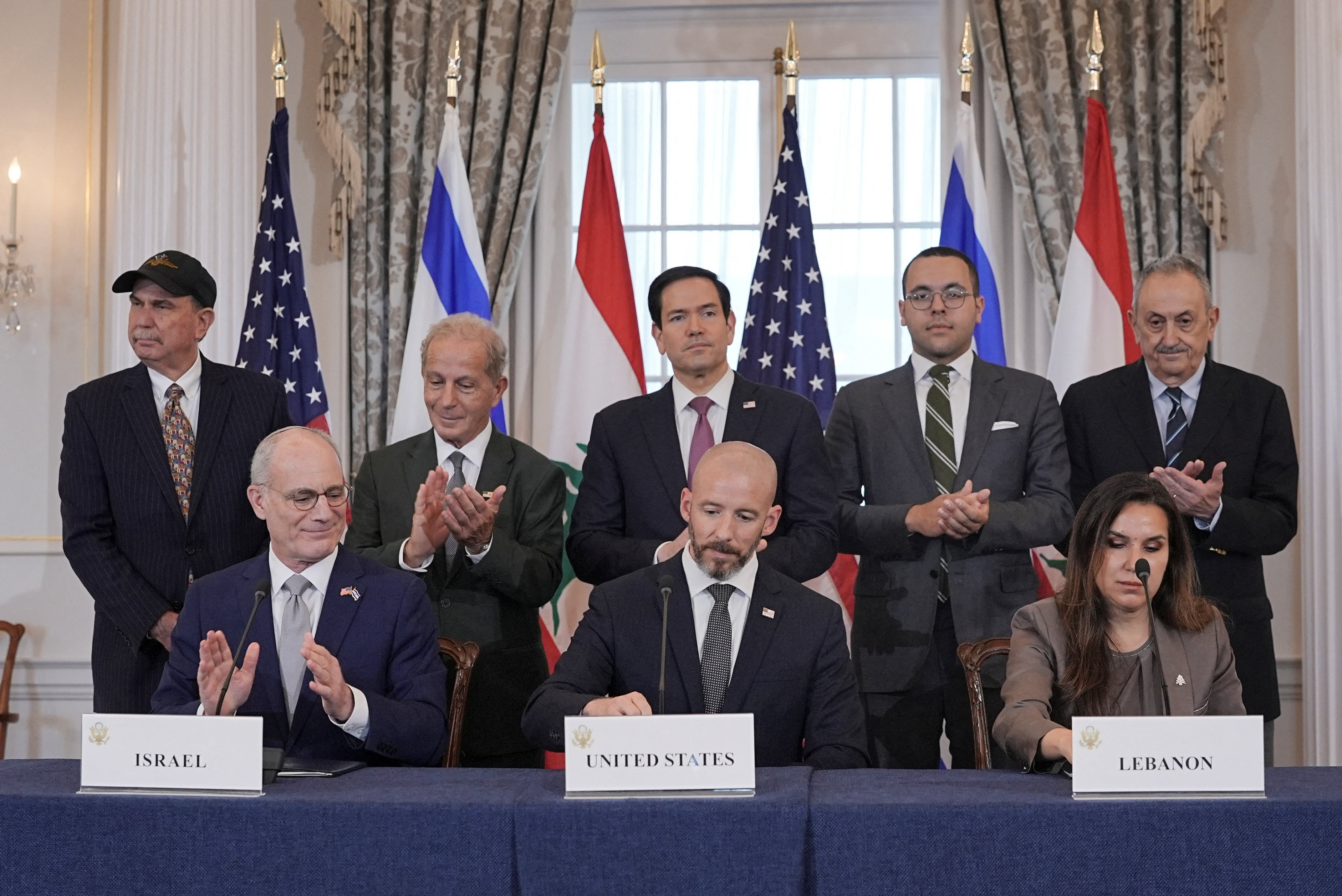 U.S. Secretary of State Marco Rubio and Israel's Ambassador to the U.S. Yechiel Leiter applaud after signing a framework agreement between Israel and Lebanon with State Department Counselor Daniel Holler, and Lebanon's Ambassador to the U.S. Nada Hamadeh, at the State Department in Washington, D.C., U.S., June 26, 2026. REUTERS/Ken Cedeno