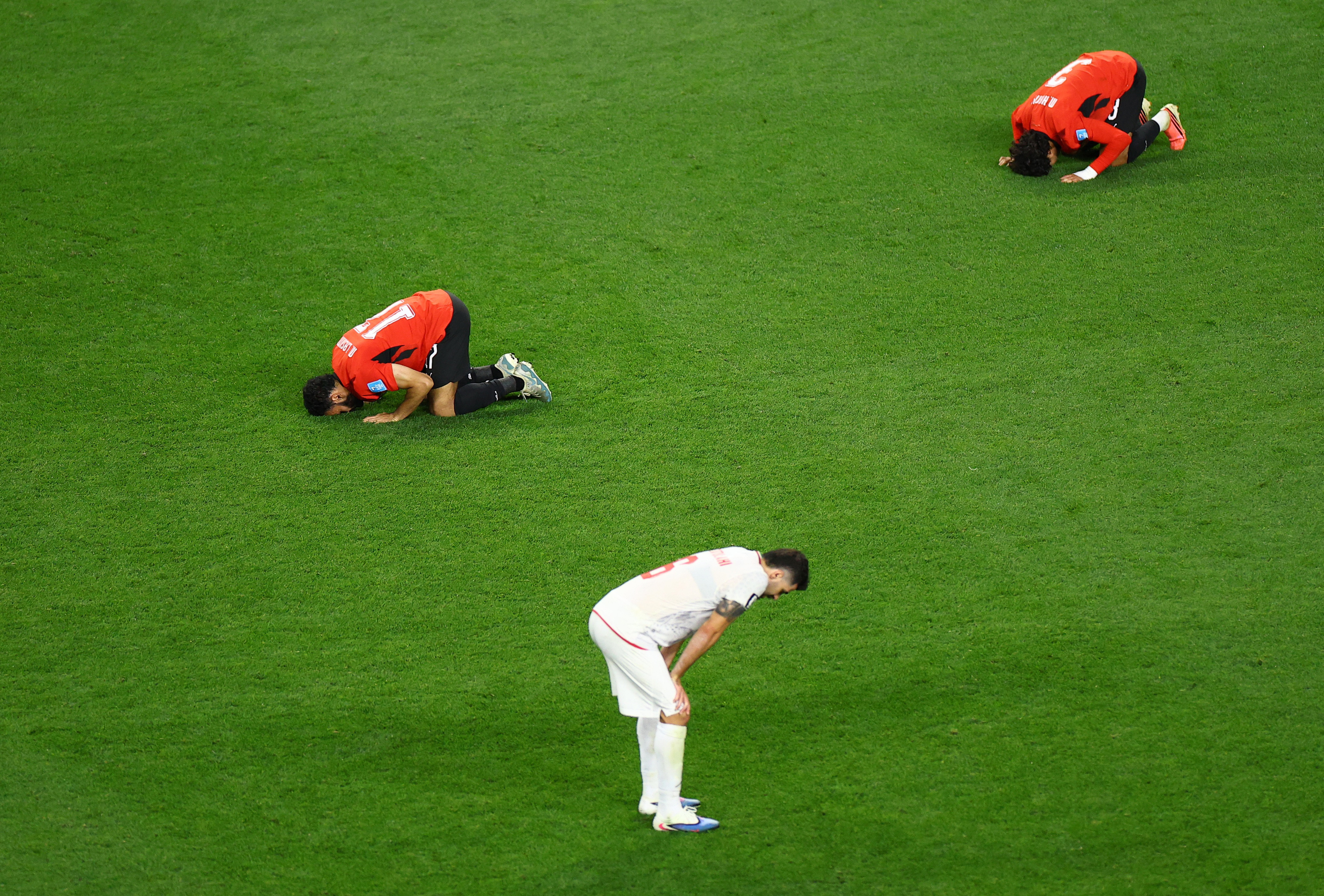 Soccer Football - FIFA World Cup 2026 - Group G - Egypt v Iran - Seattle Stadium, Seattle, Washington, U.S. - June 26, 2026 Egypt's Mohanad Lashin and Egypt's Mohamed Hany celebrate as Iran's Saeid Ezatolahi looks dejected after the match REUTERS/Lisi Niesner