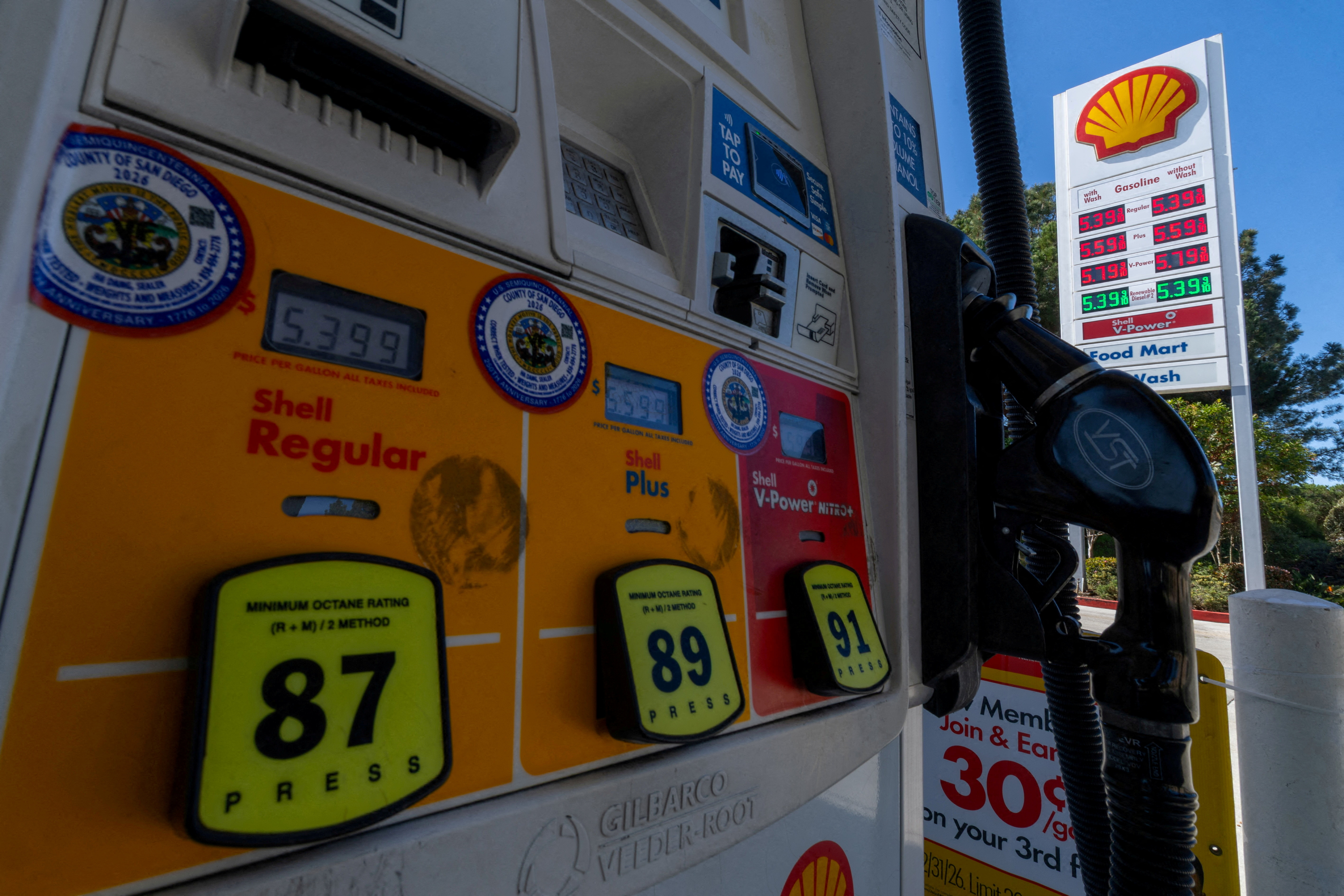 FILE PHOTO: Gasoline prices are displayed on a gas pump in Del Mar, California, U.S., March 3, 2026. REUTERS/Mike Blake/File Photo