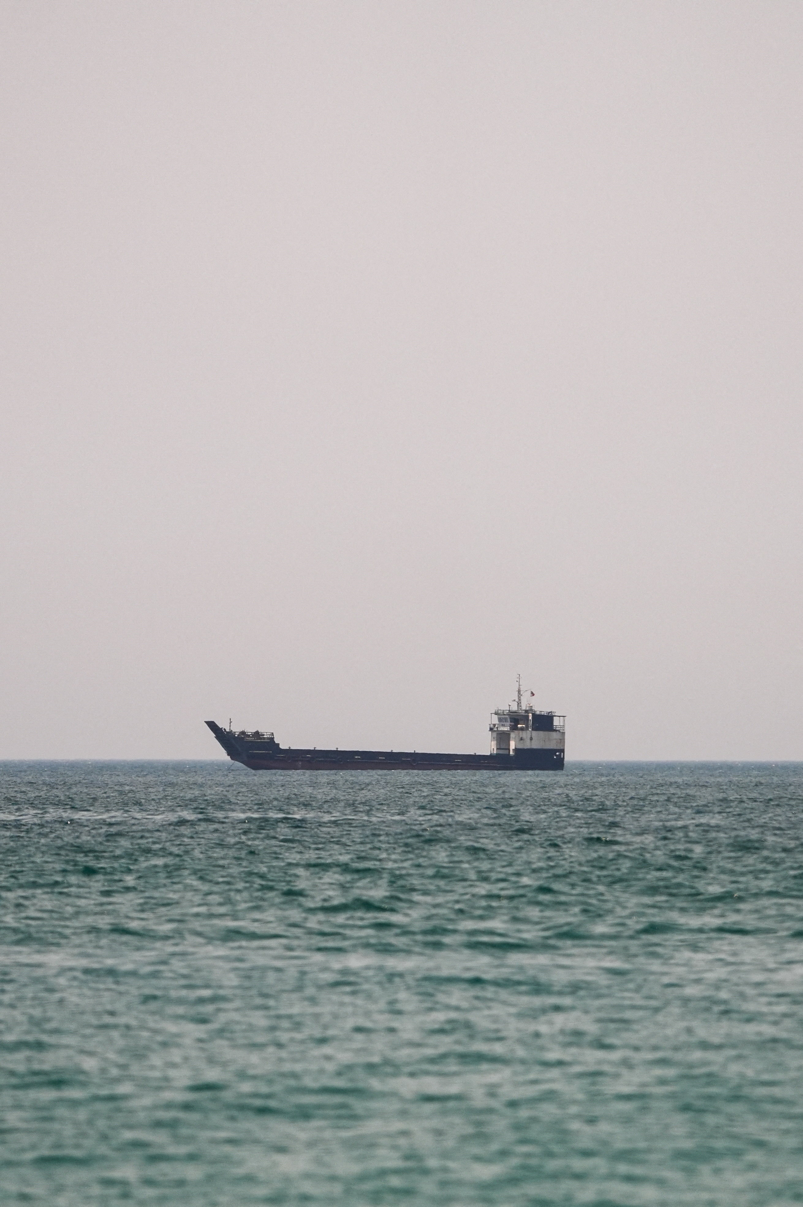A vessel at the Strait of Hormuz, as seen from Musandam, Oman, June 29, 2026. REUTERS/Stringer